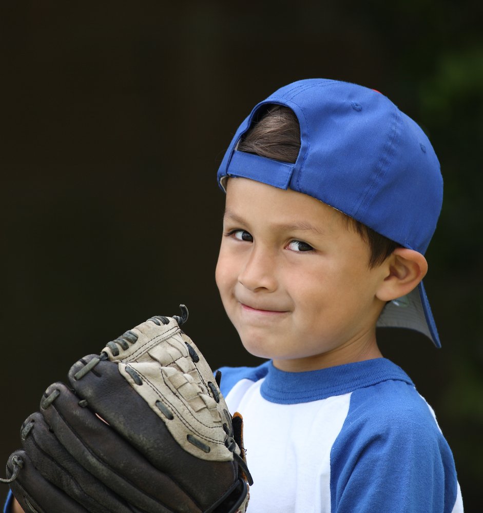 Boy with a baseball glove | Source: Shutterstock