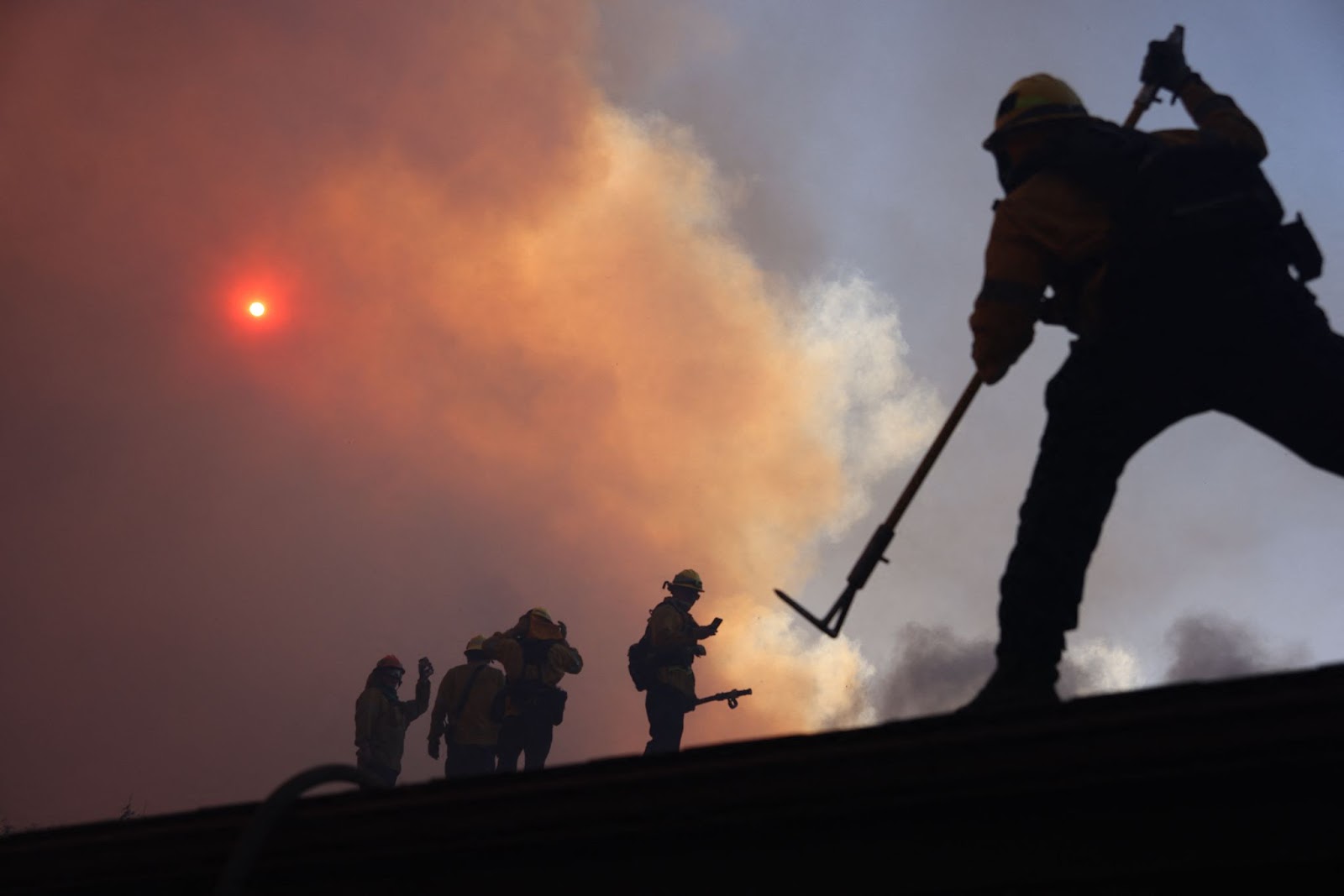 Firefighters working to put out the Palisades fire in Los Angeles, California, on January 7, 2025. | Source: Getty Images