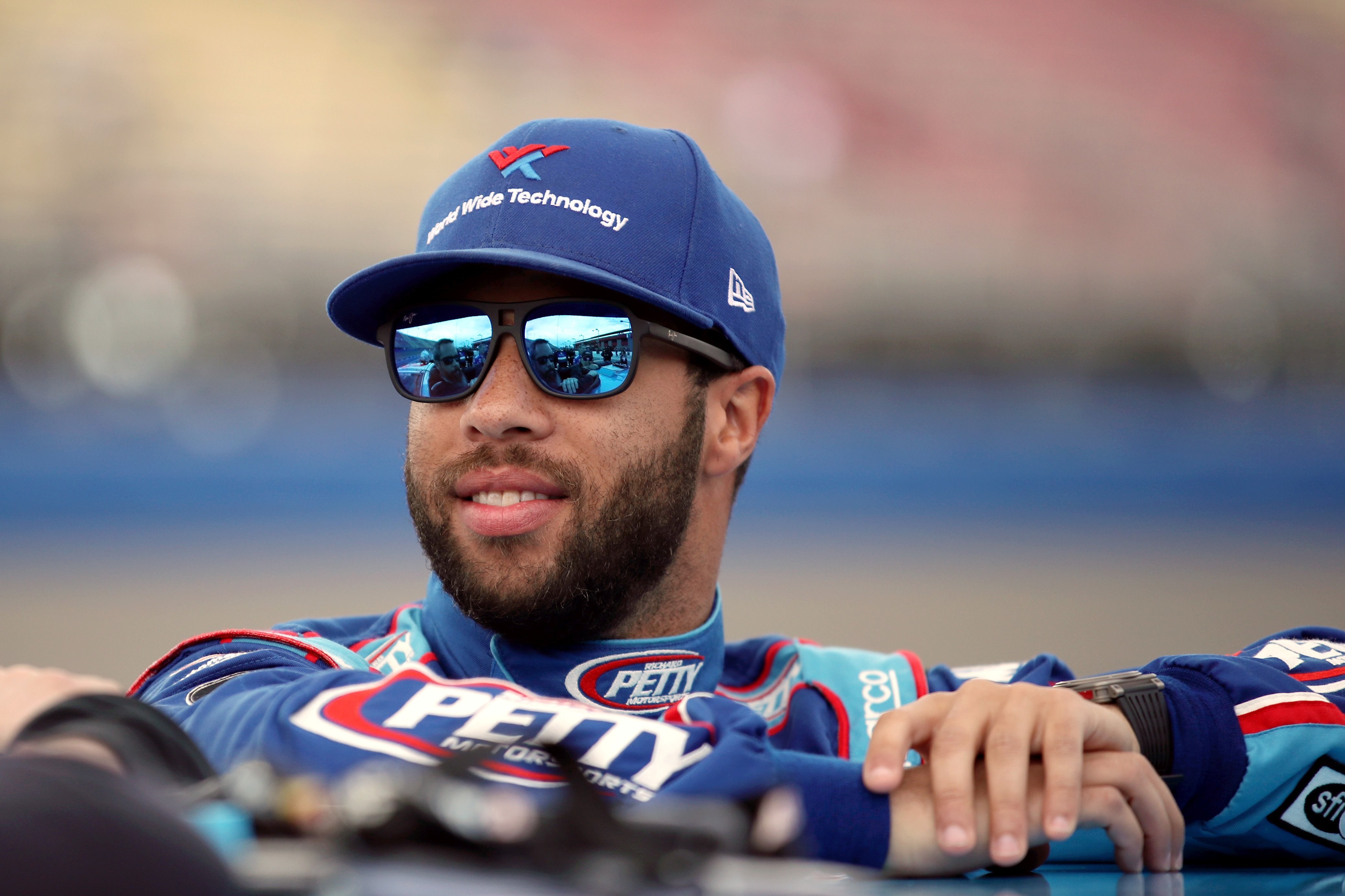 Bubba Wallace stands by his car at Auto Club Speedway on February 29, 2020, in Fontana, California. | Source: Getty Images.