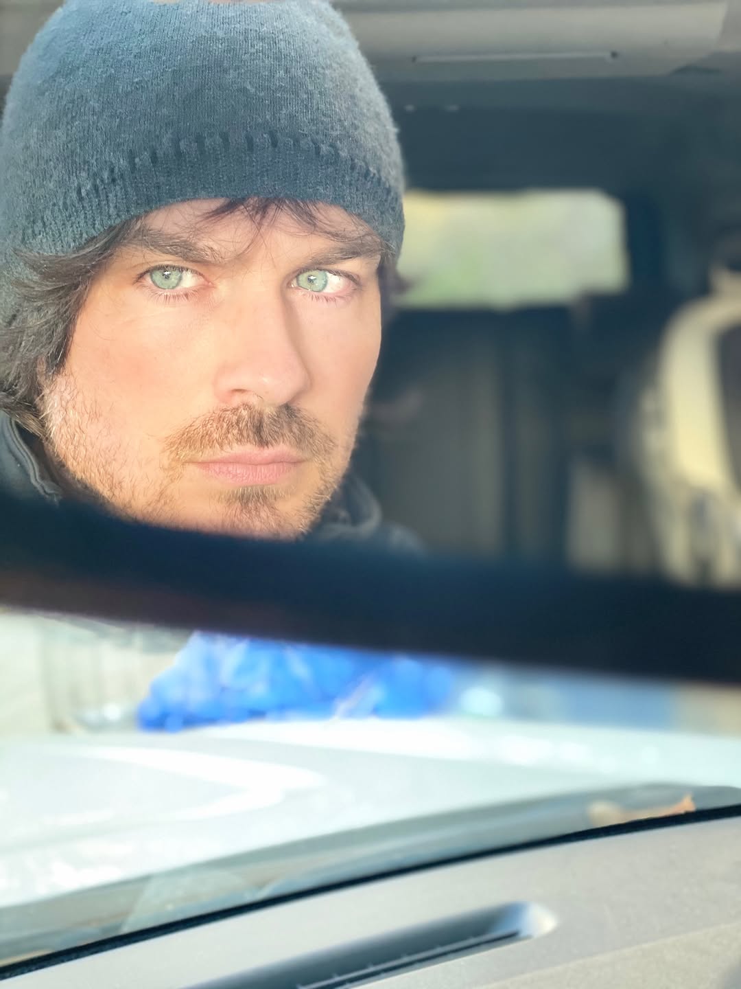 Ian Somerhalder looks at something in the distance as he takes a photo in a car. | Source: Instagram/iansomerhalder