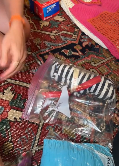 Courtney Shields packing her outfits in Ziploc bags, as seen in a video June 10, 2023 | Source: TikTok/@courtney.shields