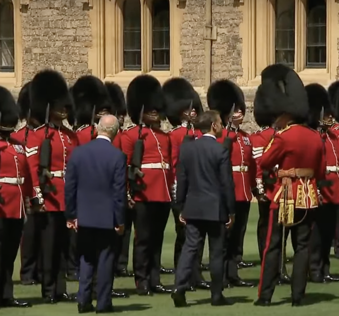 King Charles III and President Emmanuel Macron during a ceremonial inspection at Windsor Castle from a post dated July 8, 2025. | Source: YouTube/Sky News