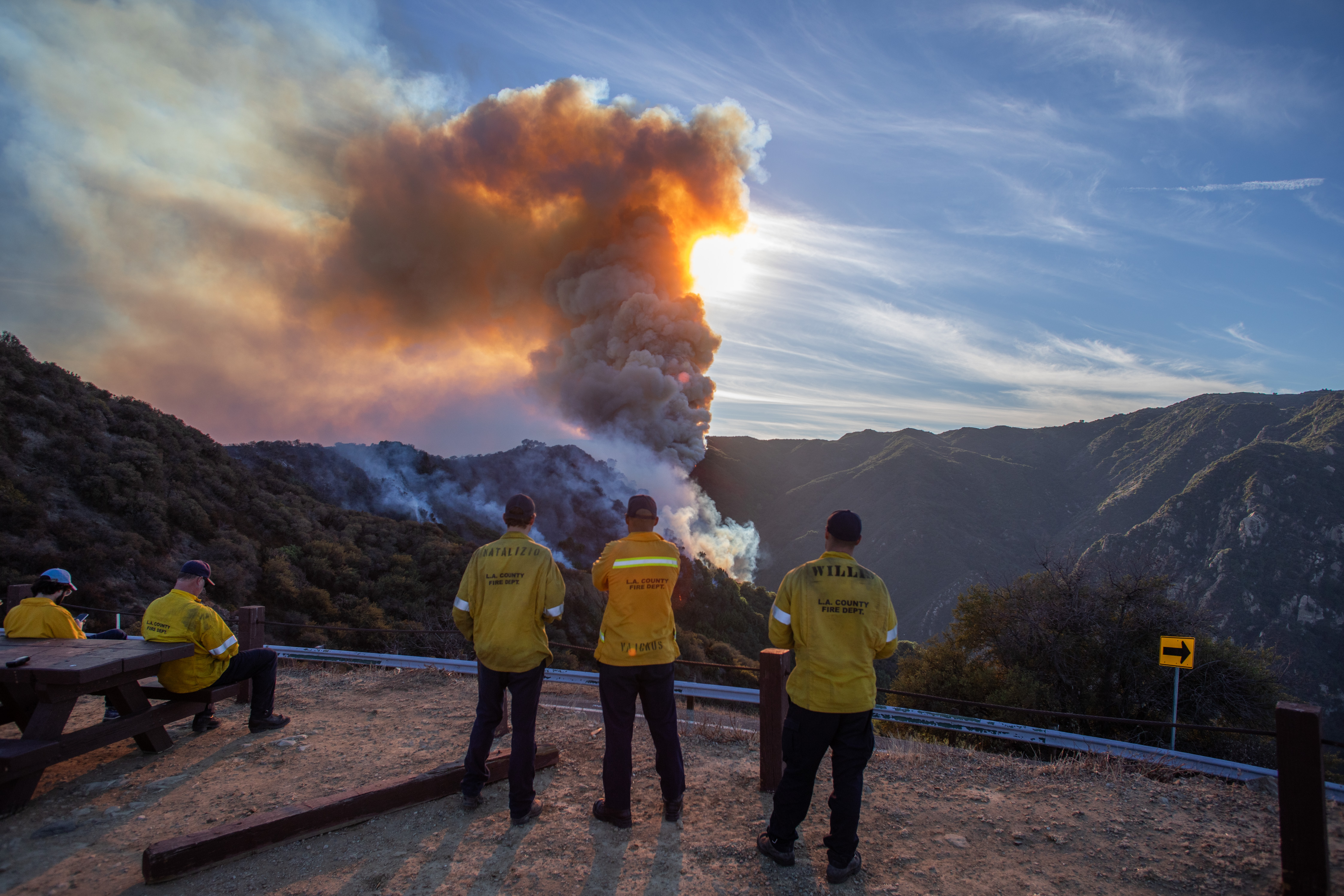 Firefighters monitor as the Franklin Fire burns a mountainside near Malibu, California, on December 10, 2024 | Source: Getty Images