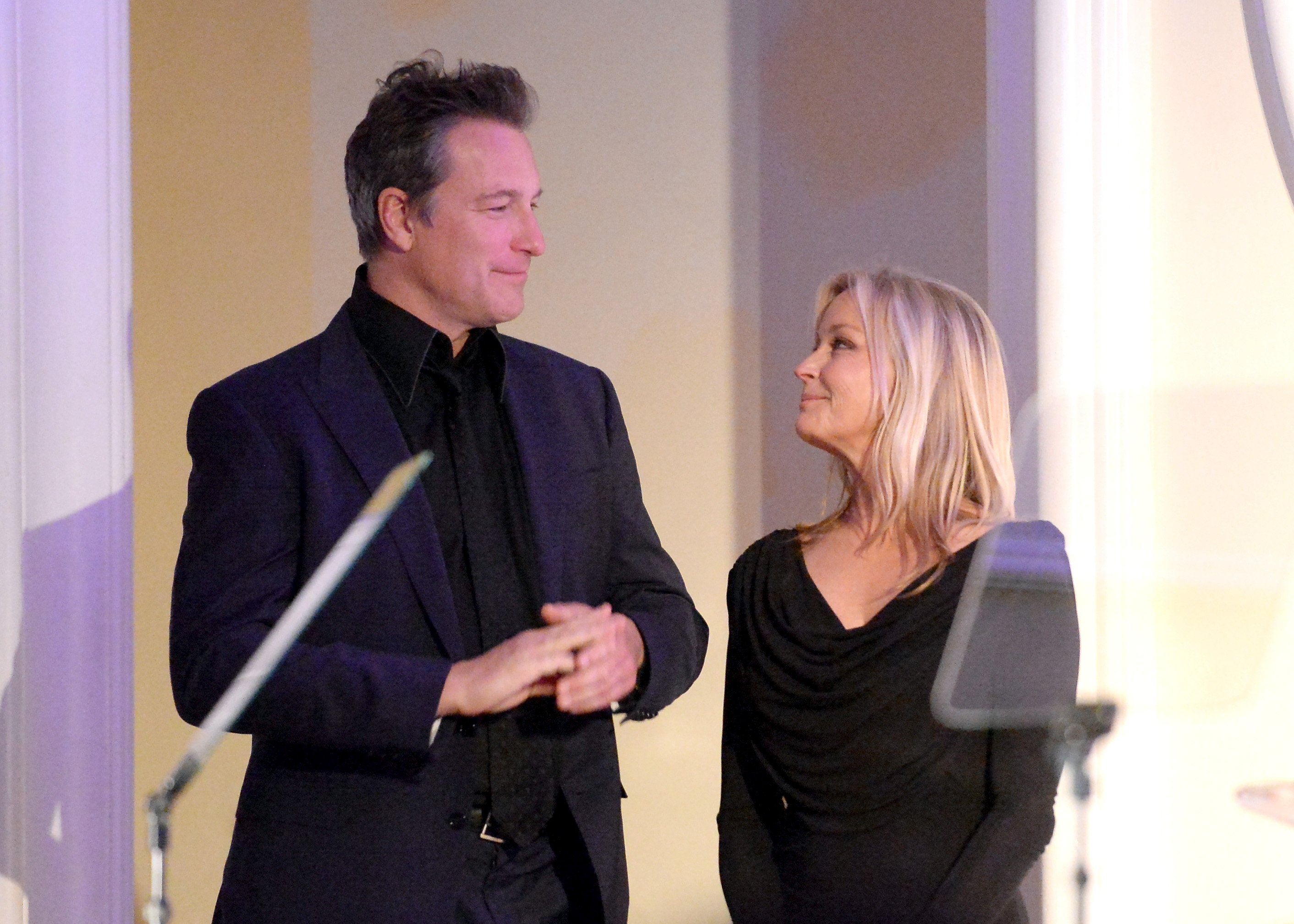 John Corbett and Bo Derek speak onstage during the International Women's Media Foundation's 2013 Courage in Journalism Awards at the Beverly Hills Hotel on October 29, 2013 in Beverly Hills, California  | Source: Getty Images