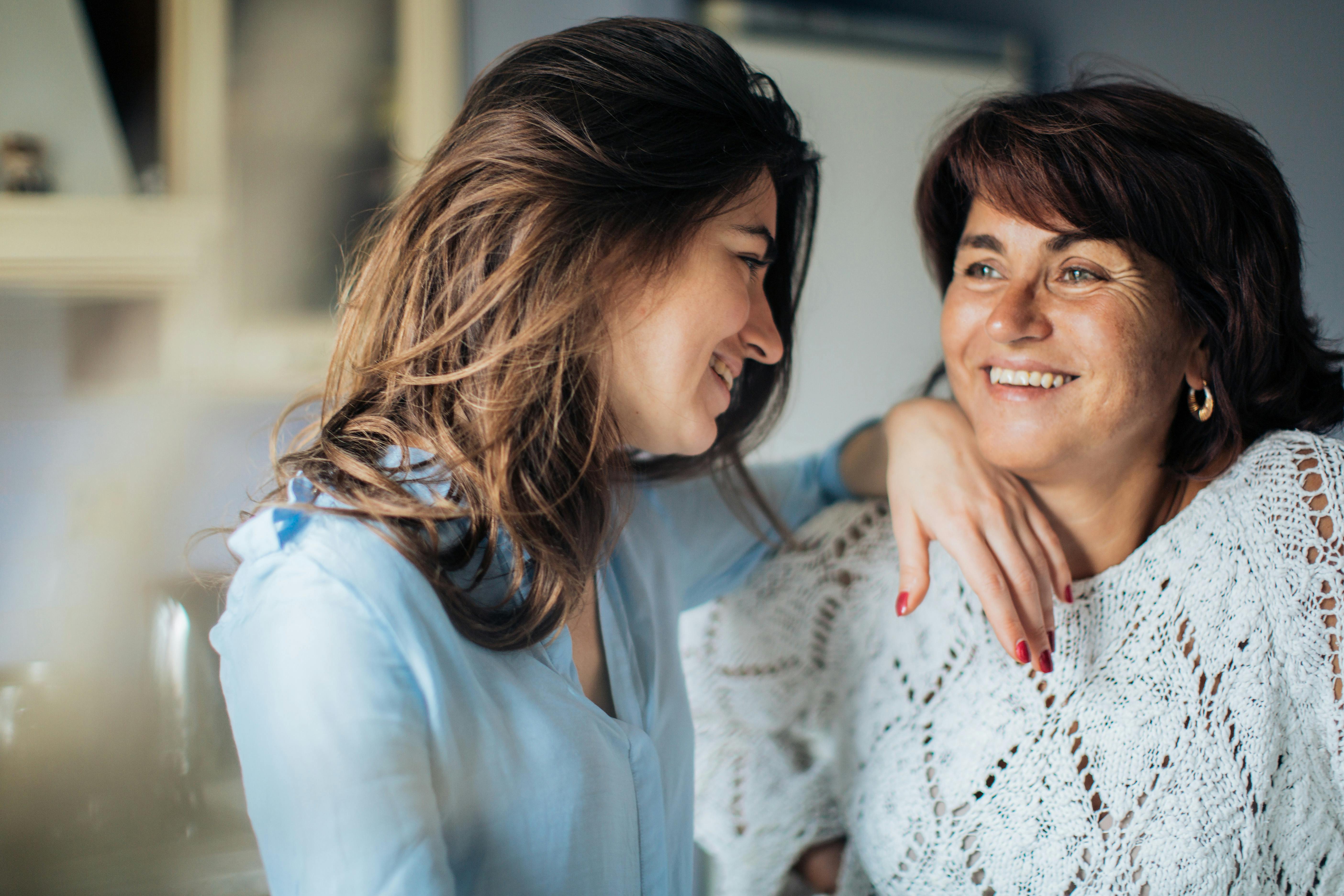 Mother and daughter smiling at each other | Source: Pexels