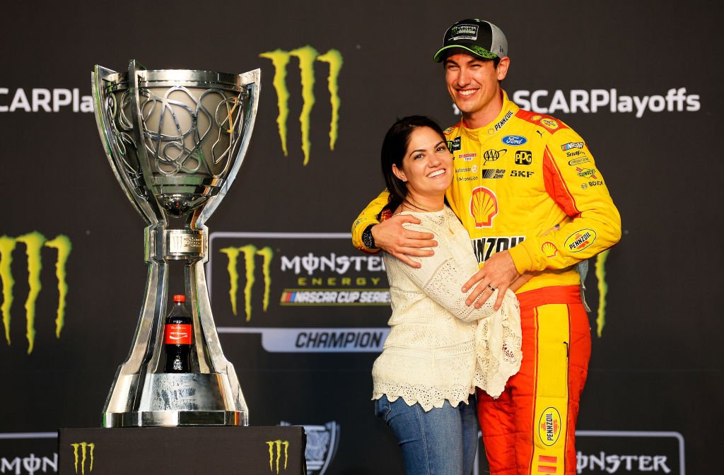 Joey Logano celebrates with his wife, Brittany after winning the Monster Energy NASCAR Cup Series Ford EcoBoost 400 and the Monster Energy NASCAR Cup Series Championship on November 18, 2018 in Homestead, Florida | Photo: Getty Images