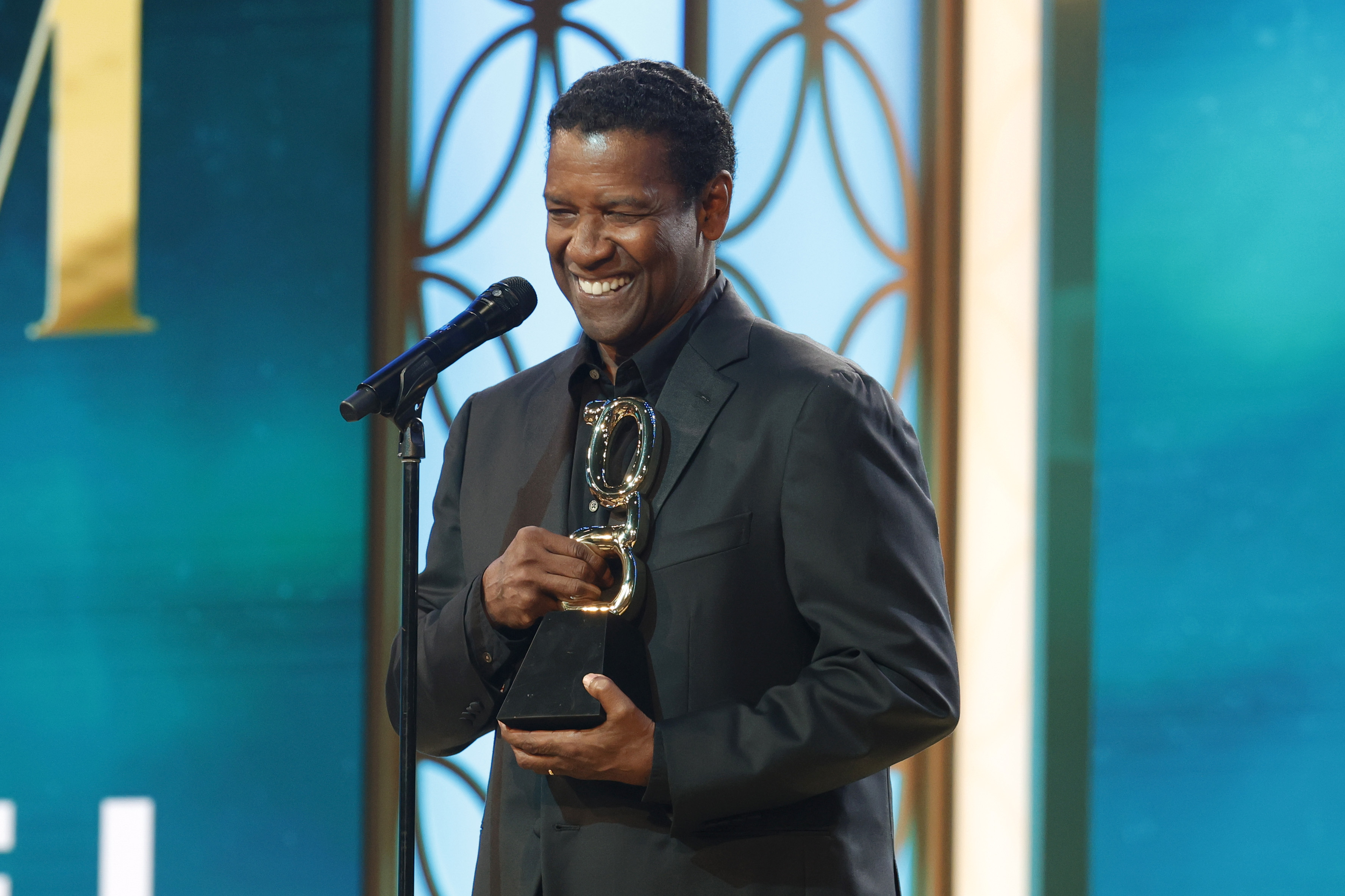 Denzel Washington receiving the Film Icon Award during the 2nd Annual theGrio Awards in Beverly Hills, California on October 21, 2023 | Source: Getty Images