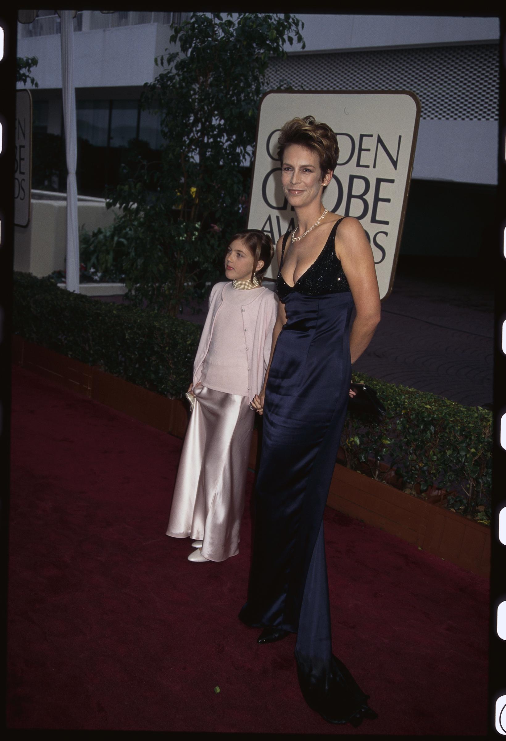 Jamie Lee Curtis and Annie Guest attend the 54th Golden Globe Award Ceremony in 1996 | Source: Getty Images