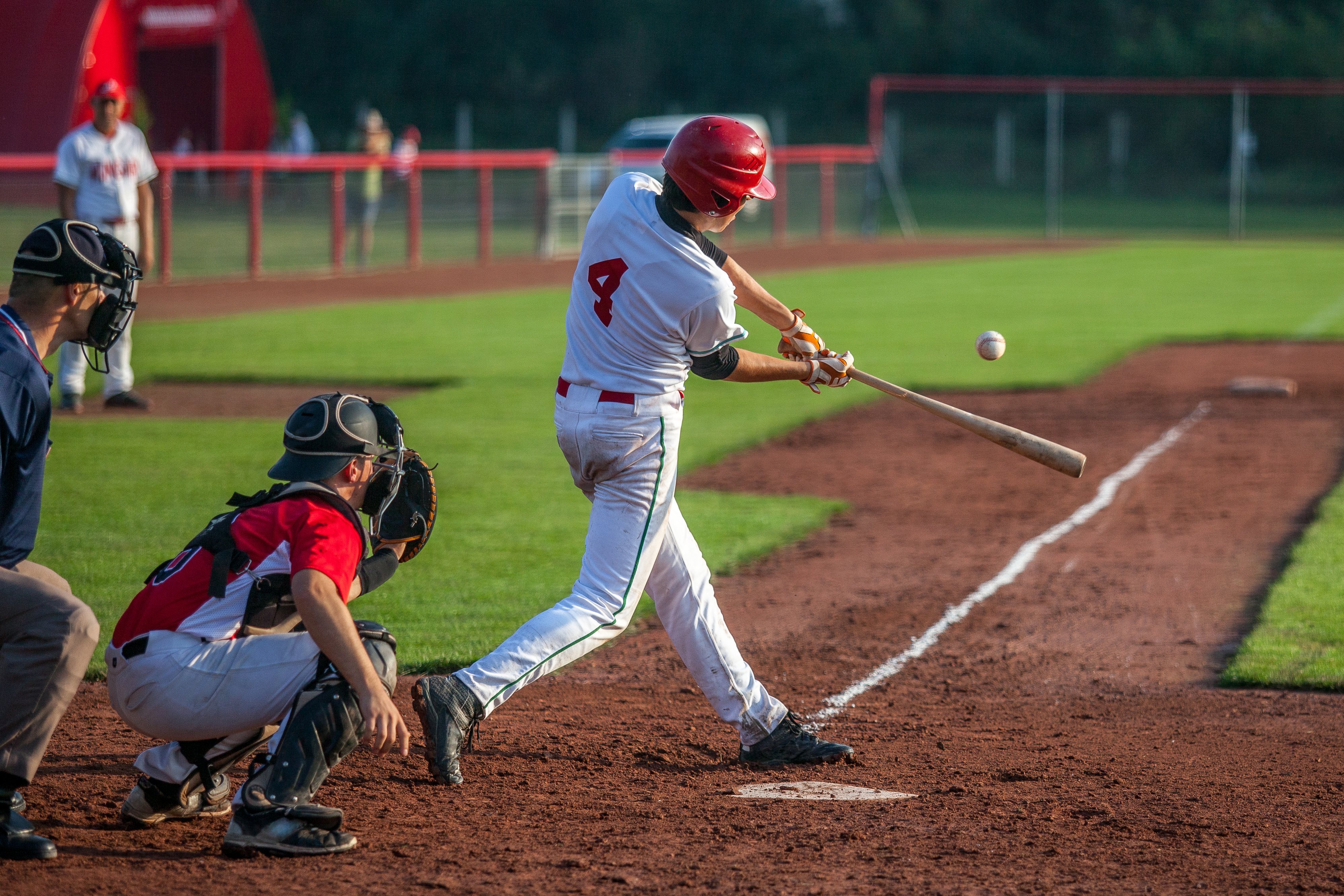 Baseball batter hits the ball | Photo: Shutterstock 
