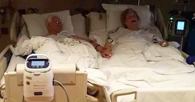 Trent und Dolores Winstead halten sich an den Händen, während sie in ihren Krankenhausbetten nebeneinander liegen. | Quelle: Twitter.com/ABC7