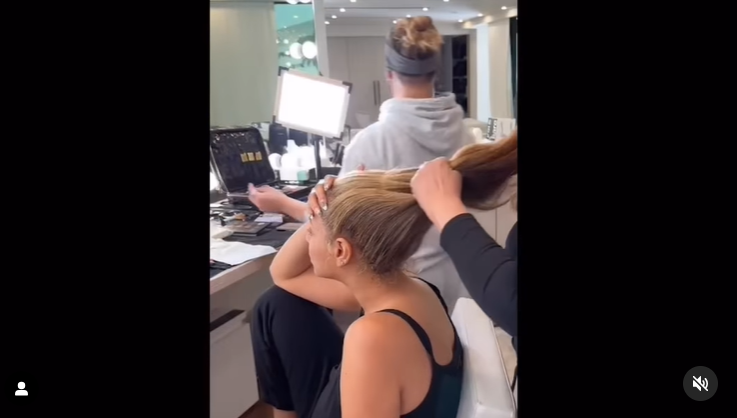 Beyoncé sits on a makeup as a stylist parts her blonde hair in a video dated April 2024. | Source: Instagram/beyonce