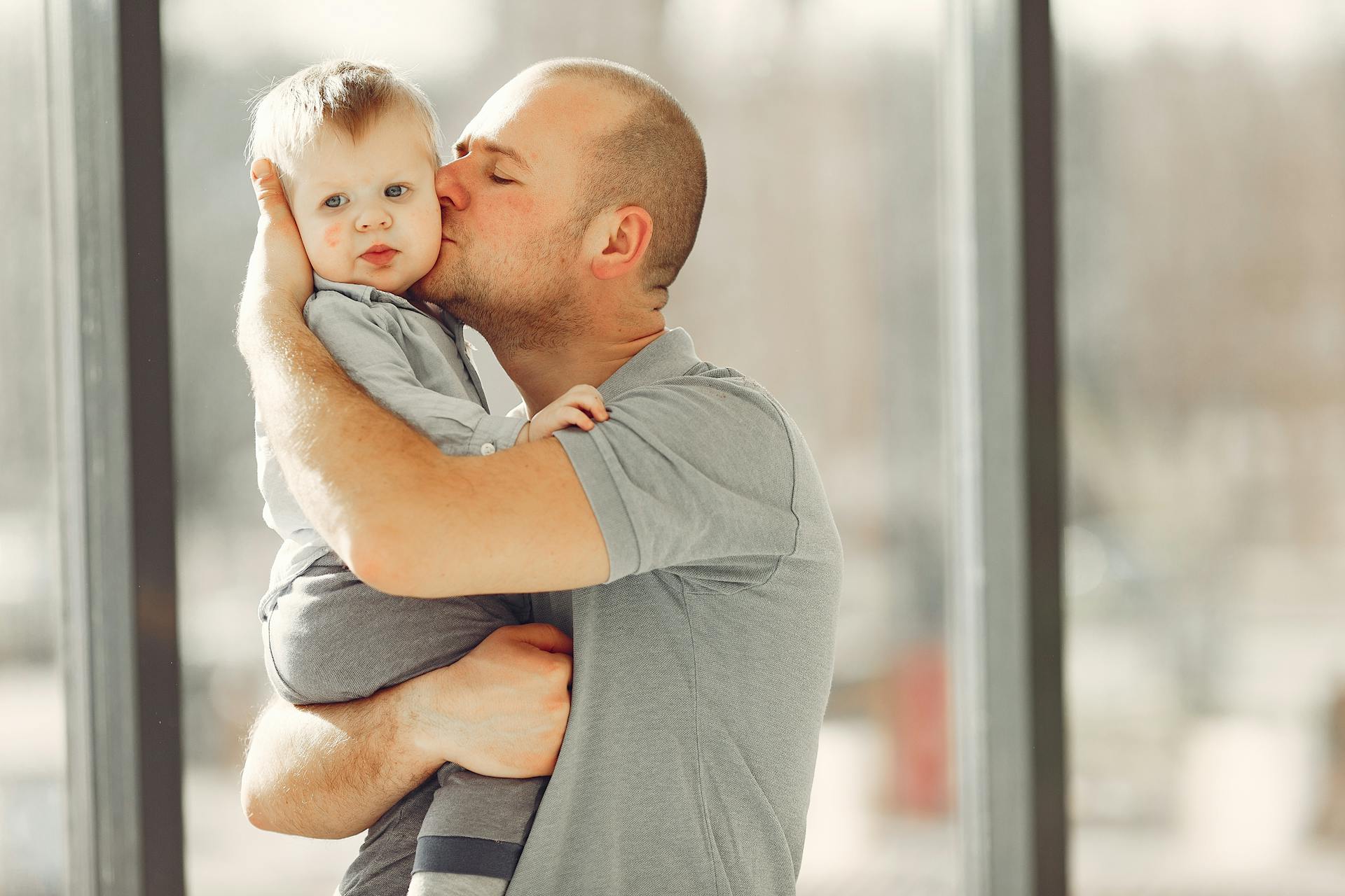 A father kissing his baby | Source: Pexels