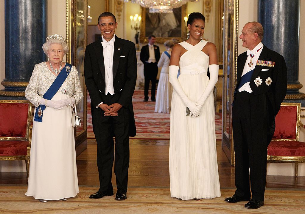 Queen Elizabeth II poses with U.S. President Barack Obama, his wife Michelle Obama and Prince Philip, Duke of Edinburgh in the Music Room of Buckingham Palace ahead of a State Banquet in London, England | Photo: Getty Images