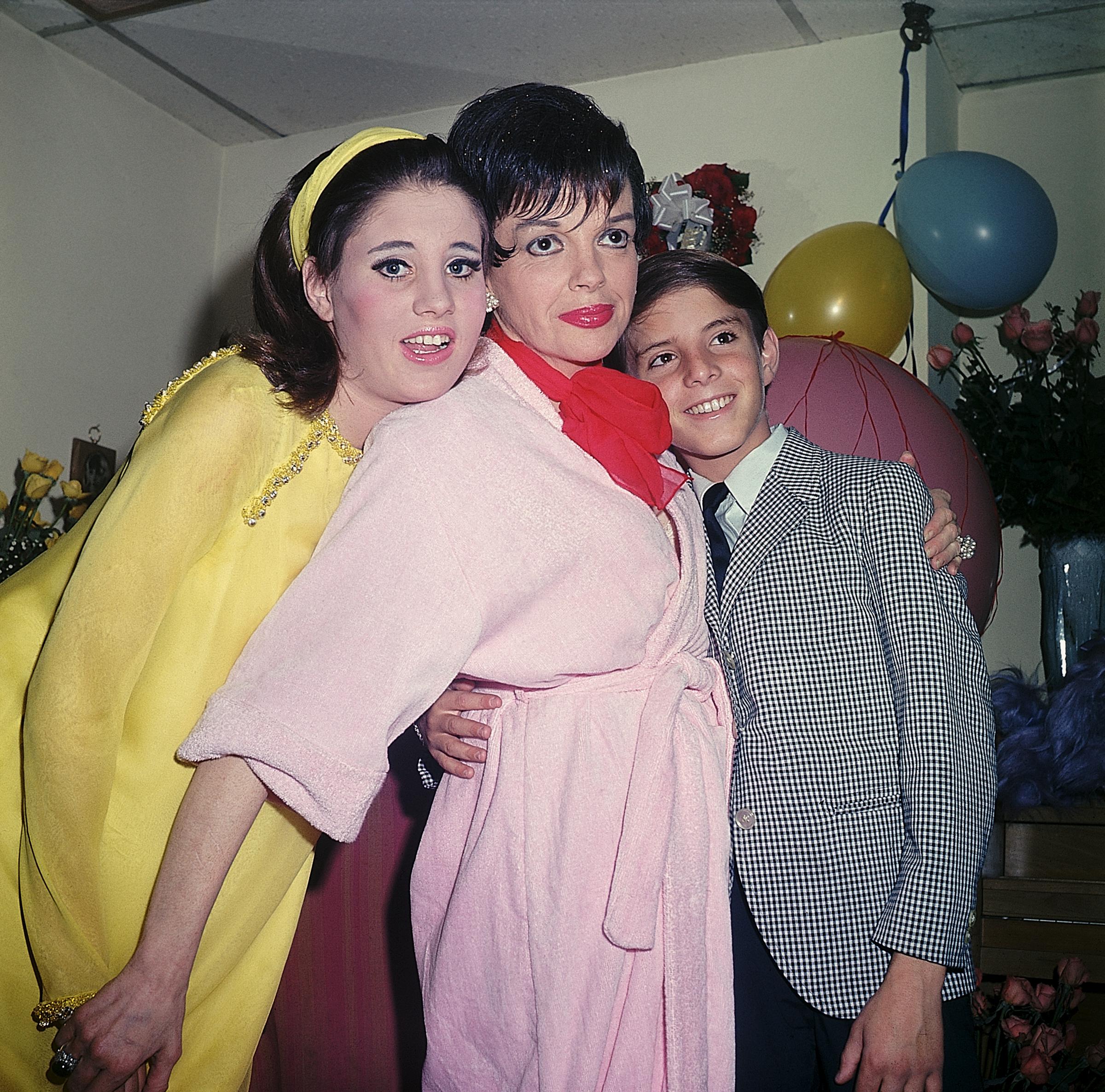 The actress, Judy Garland, and Joey Luft photographed in a dressing room on July 31, 1967 | Source: Getty Images