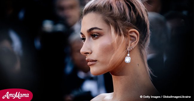 Hailey Baldwin shows off her toned body wearing a white one-piece swimsuit in a recent photo
