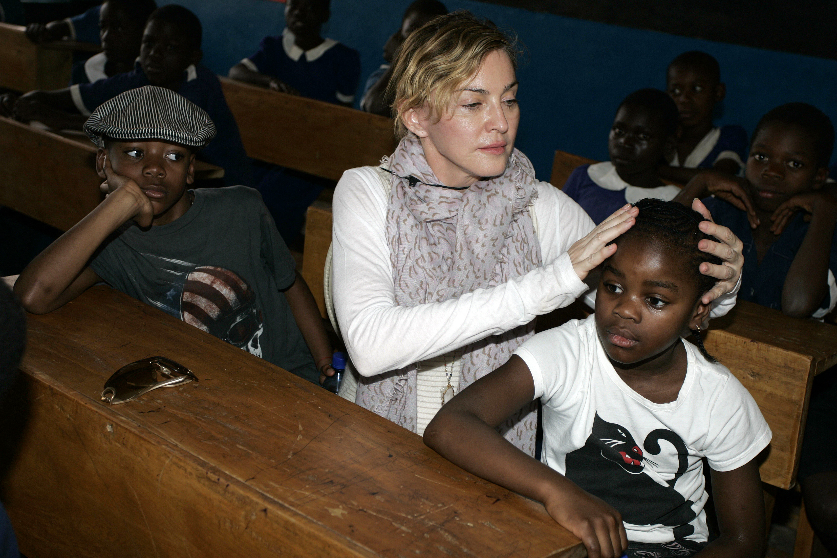 David Banda, Madonna and Mercy James at Mkoko Primary School in the area of Santhe in Kasungu district, central Malawi on April 2, 2013 | Source: Getty Images