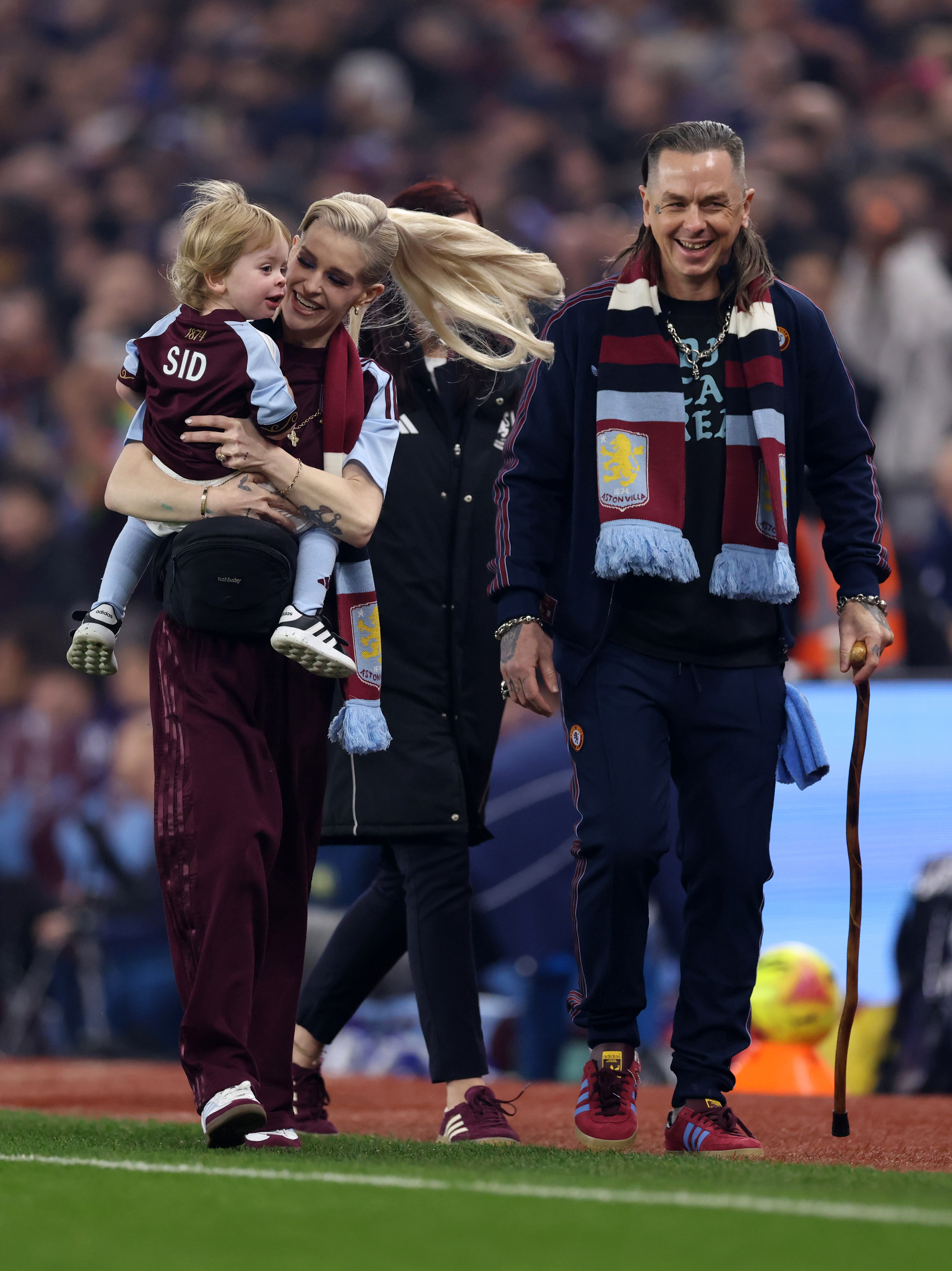 Kelly Osbourne is pictured with son Sidney and partner Sid Wilson ahead of the Premier League match between Aston Villa and Manchester United at Villa Park on 21 December 2025 in Birmingham, England. | Source: Getty Images