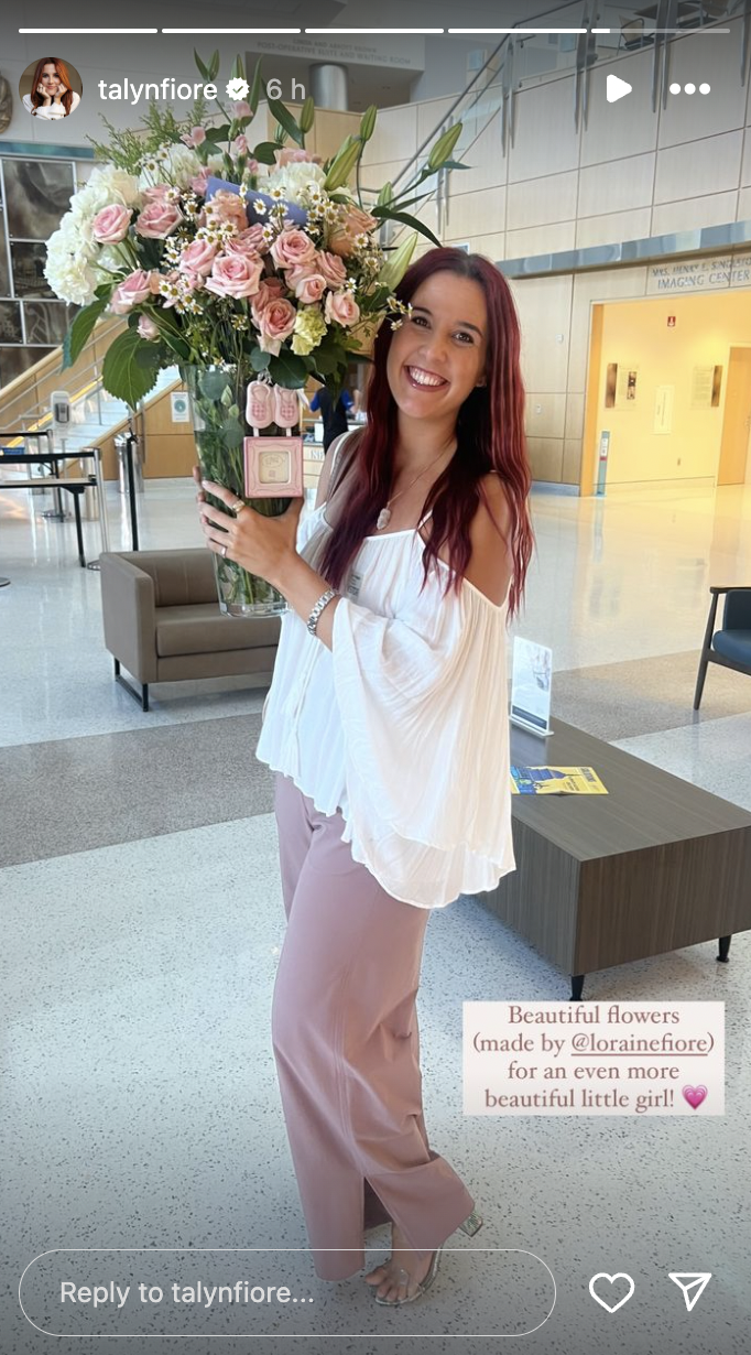 A photo of Tayln Fiore holding flowers posted on August 13, 2024 | Source: Instagram/talynfiore