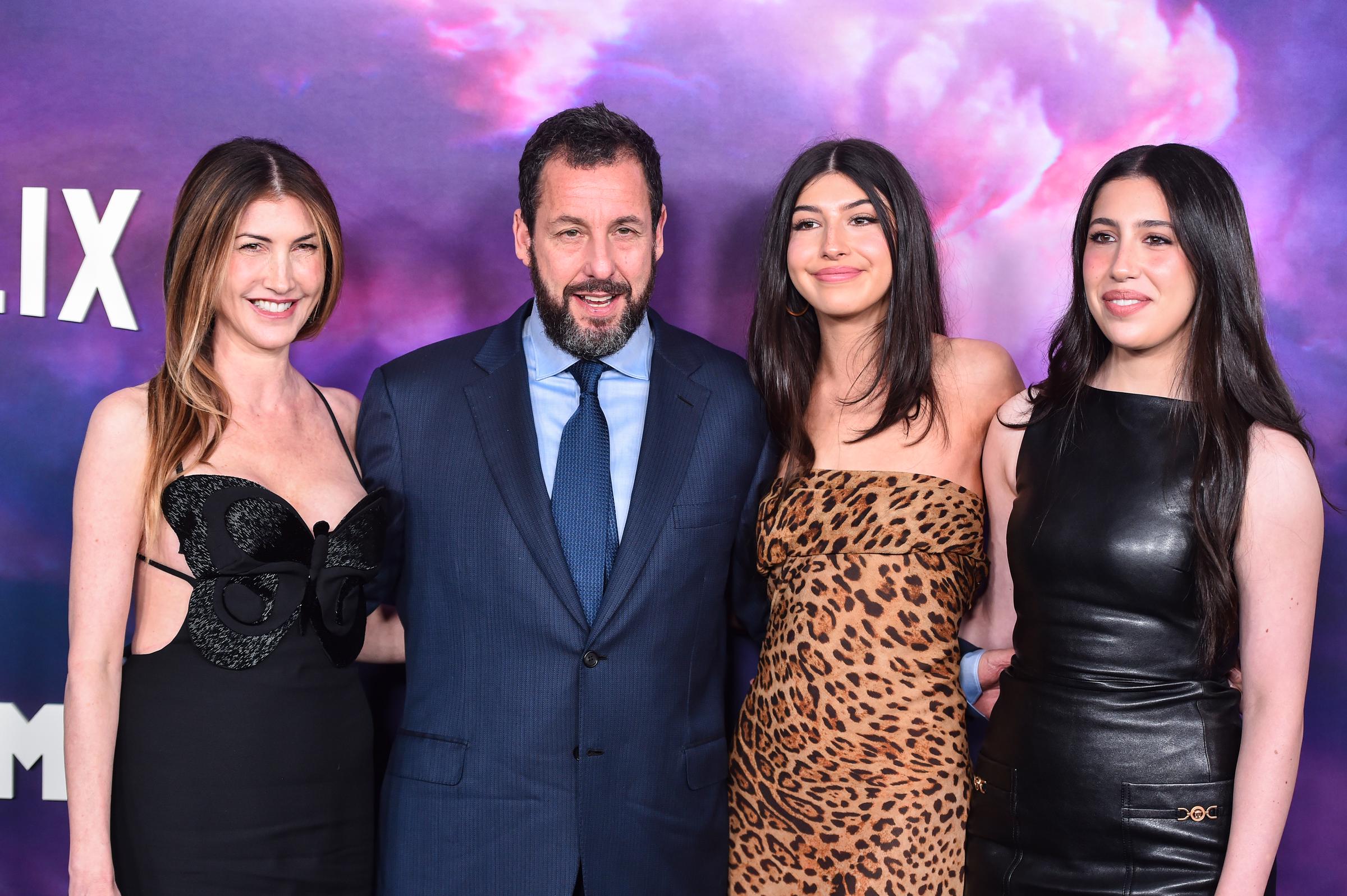 Jackie and Adam Sandler posed with their grown daughters, Sunny and Sadie, at the premiere of Netflix's "Spaceman" at The Egyptian Theatre Hollywood in Los Angeles, California. The girls looked like the perfect blend of their parents, their features beautifully mirroring both mom and dad.