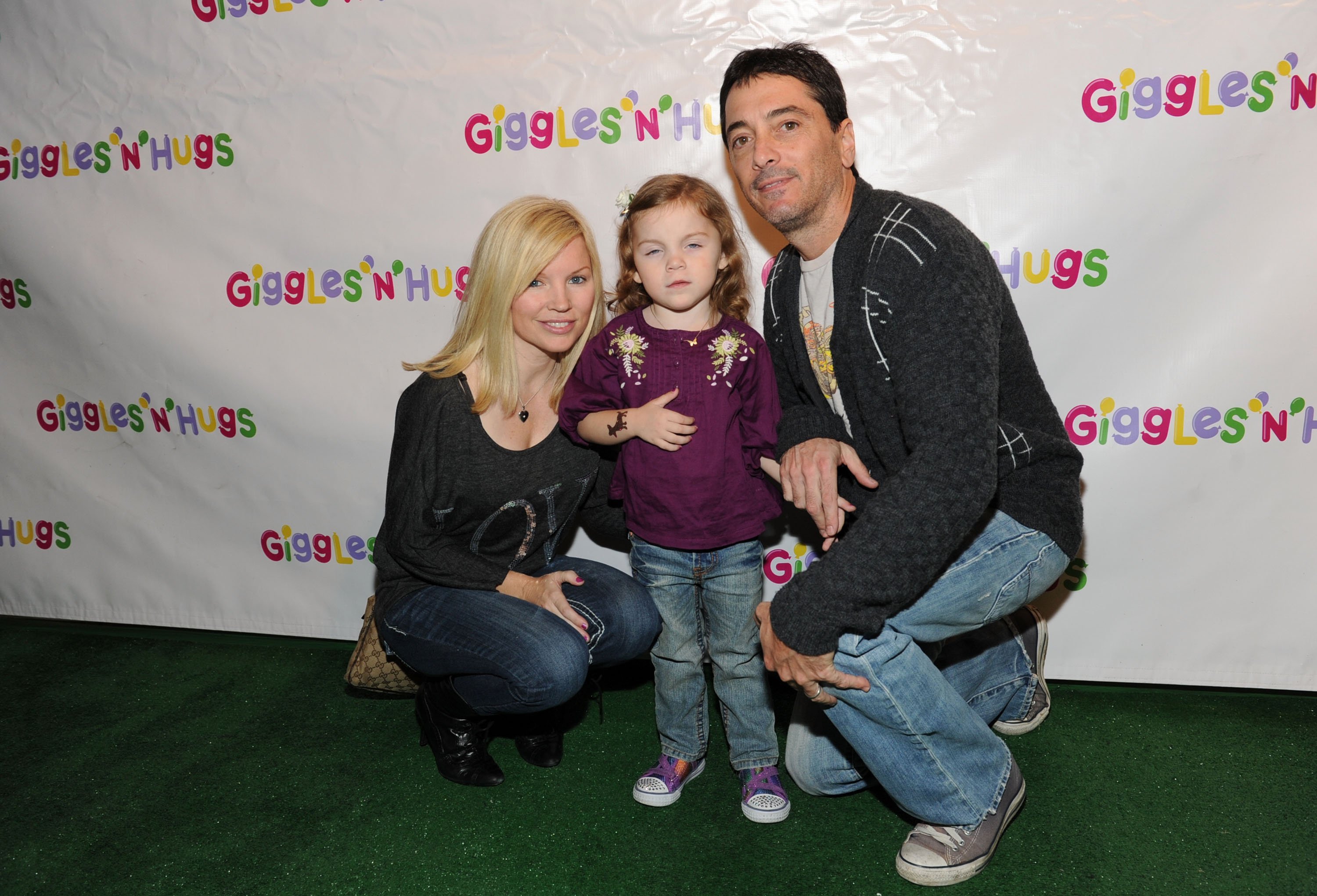 Scott Baio and family Renee Sloan and daughter Bailey DeLuca Baio arriving at Giggles 'N' Hugs opening party at Westfield Century City Mall on December 3, 2010 in Century City, California. / Source: Getty Images