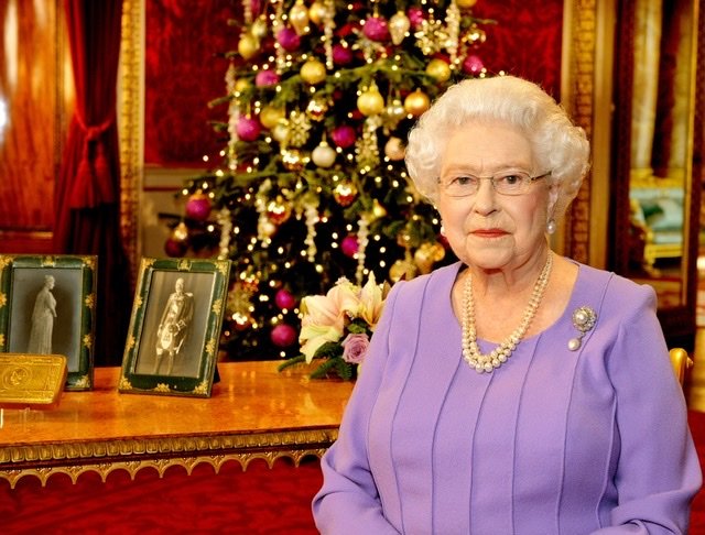 Queen Elizabeth II poses in the State Dining Room of Buckingham Palace after recording her Christmas Day television broacast on December 10, 2014 | Source: Getty Images/GlobalImagesUkraine