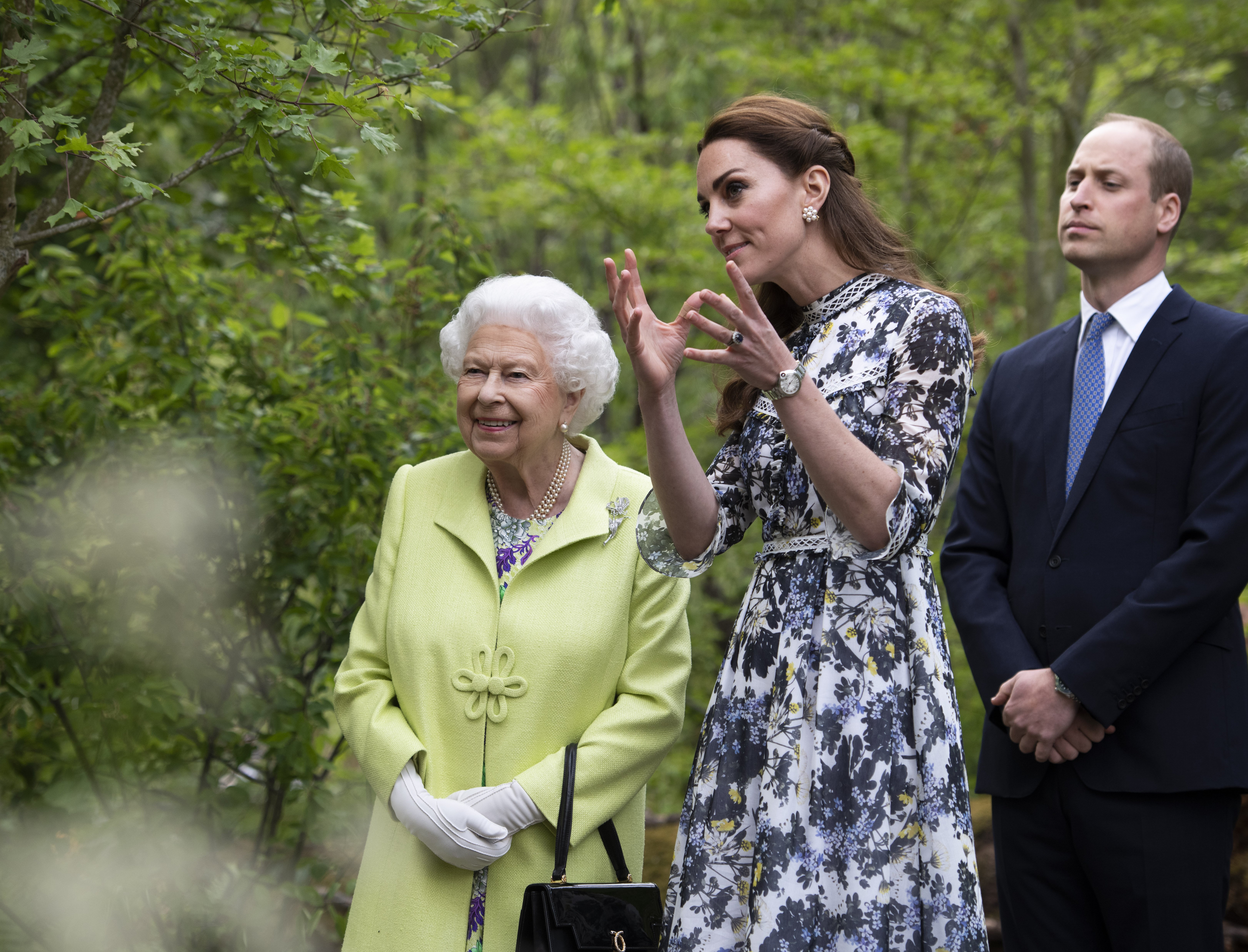 Queen Elizabeth II is shown around 'Back to Nature by Prince William and Catherine, Duchess of Cambridge at the Chelsea Flower Show on May 20, 2019, in London, England.| Source: Getty Images