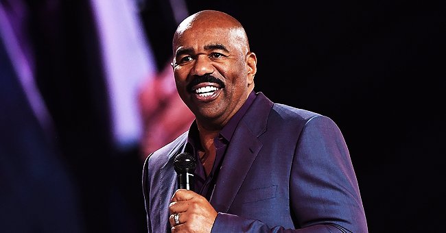 Steve Harvey Wears Purple Suit While Doing His Own Ironing in Video