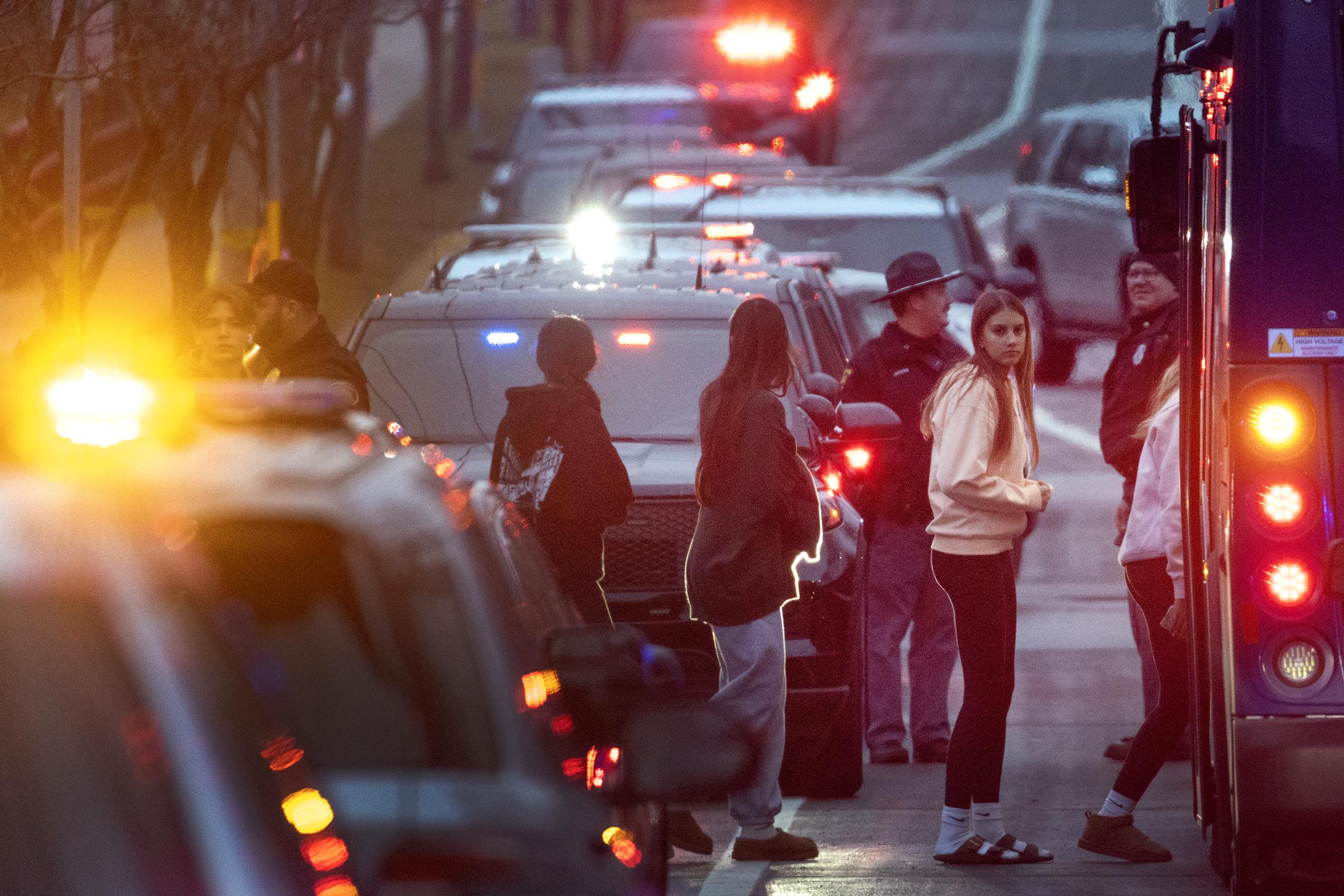 Students board buses to a reunification center near Abundant Life Christian School in Madison, Wisconsin, on December 16, 2024 | Source: Getty Images