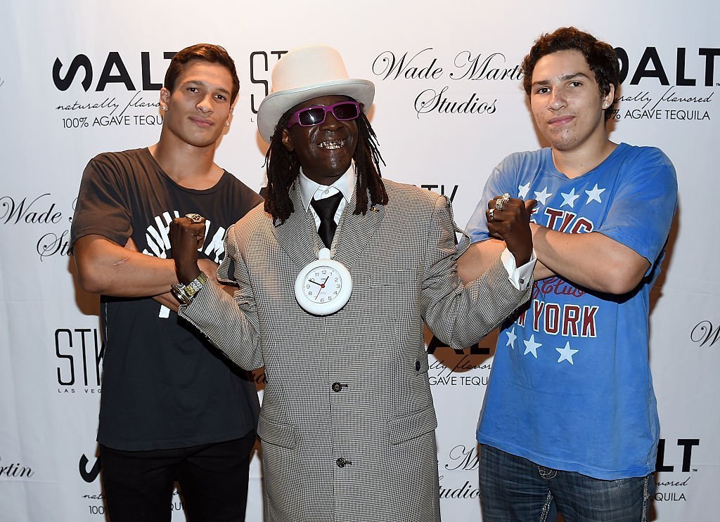 Rapper Flavor Flav (C) and Muhammad Ali's grandsons Biaggio Ali-Walsh (L) and Nico Ali-Walsh (R) attend producer Wade Martin's premiere of music videos by Flavor Flav and Coolio | Source: Getty Images