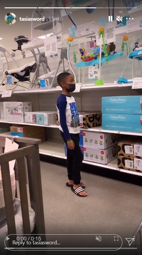 Dallas Xavier Barrino looking at baby chairs at a store. | Photo: Instagram/tasiasword