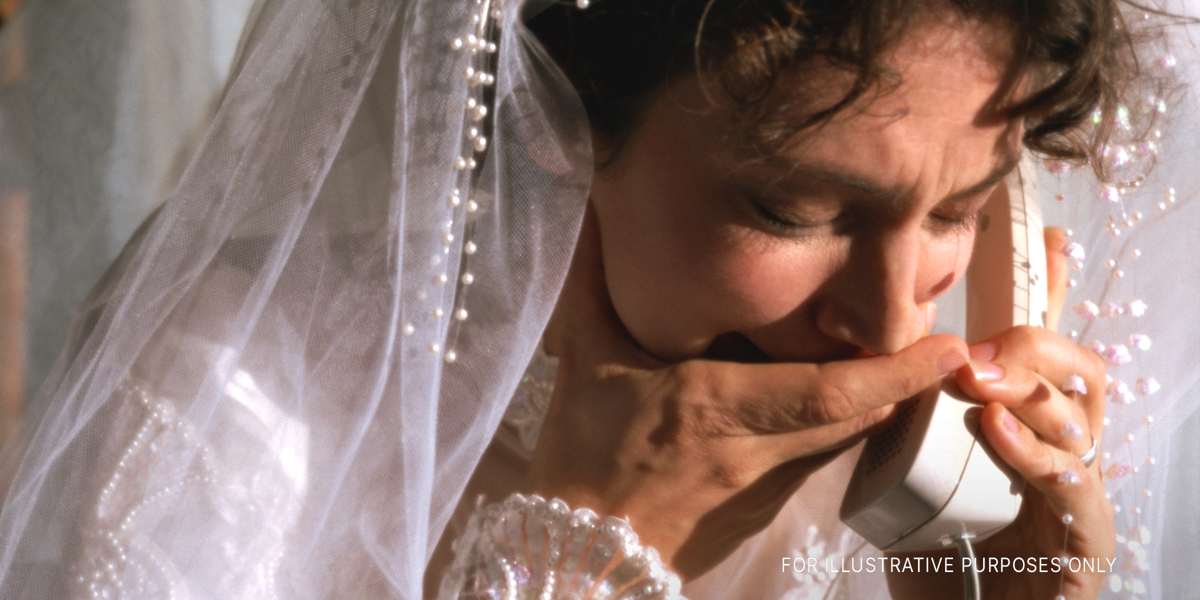 A bride crying while talking on the phone | Source: Getty Image