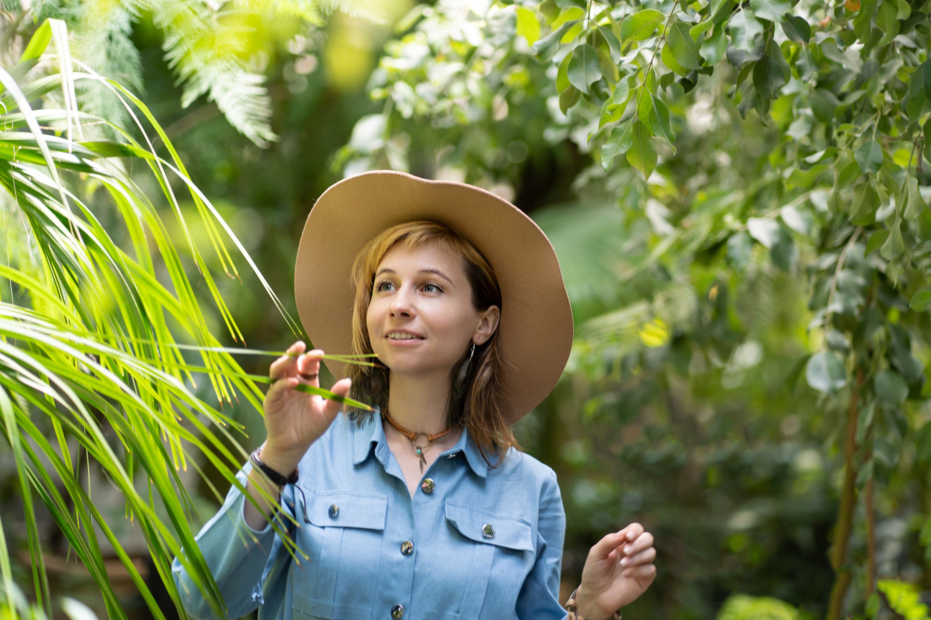 A woman delighting in greenery | Source: Pexels
