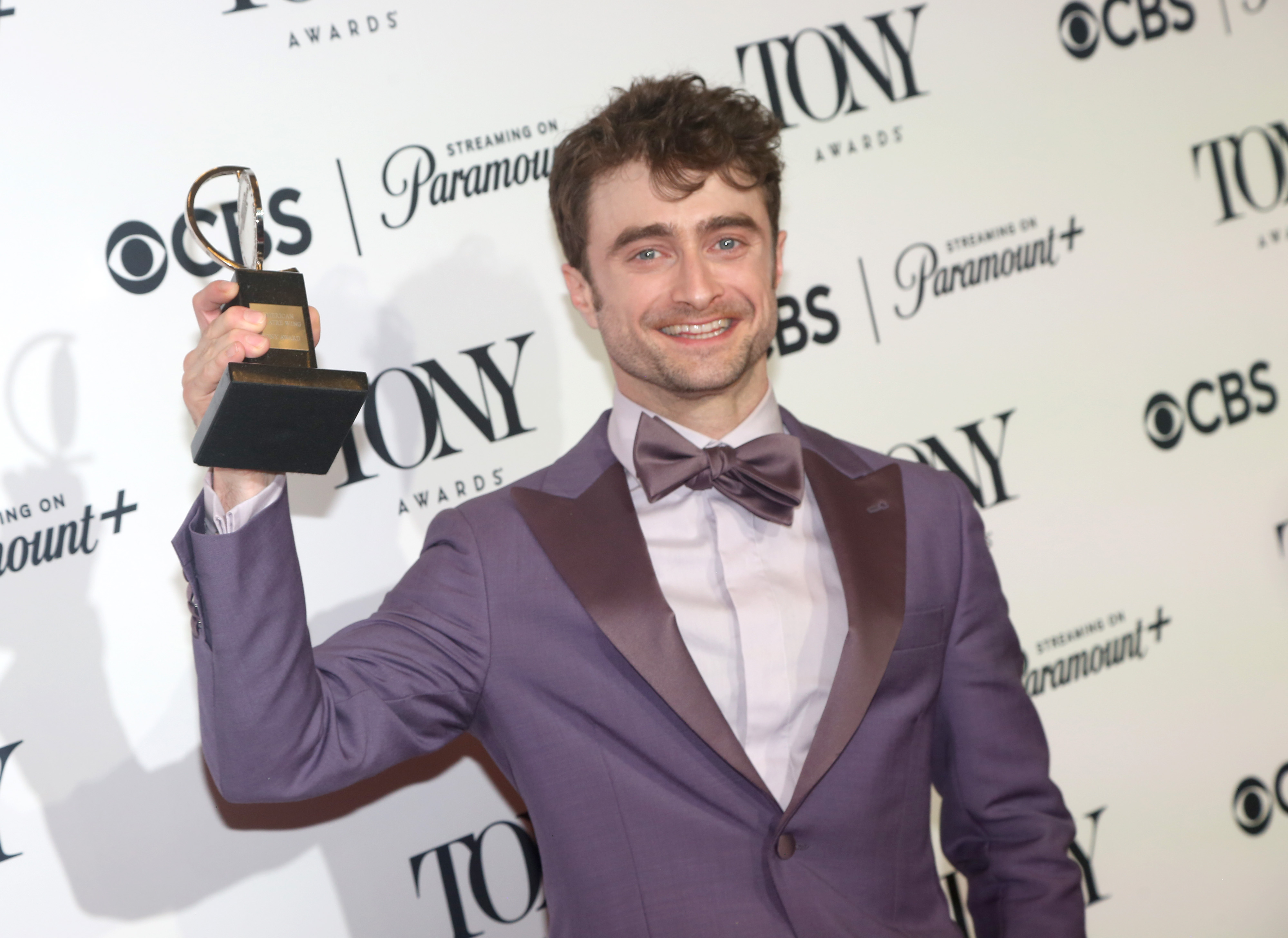 Daniel Radcliffe, winner of the Best Performance by a Featured Actor in a Musical award for “Merrily We Roll Along,” poses in the 77th Annual Tony Awards Press Room at David H. Koch Theater at Lincoln Center on June 16, 2024, in New York City | Source: Getty Images