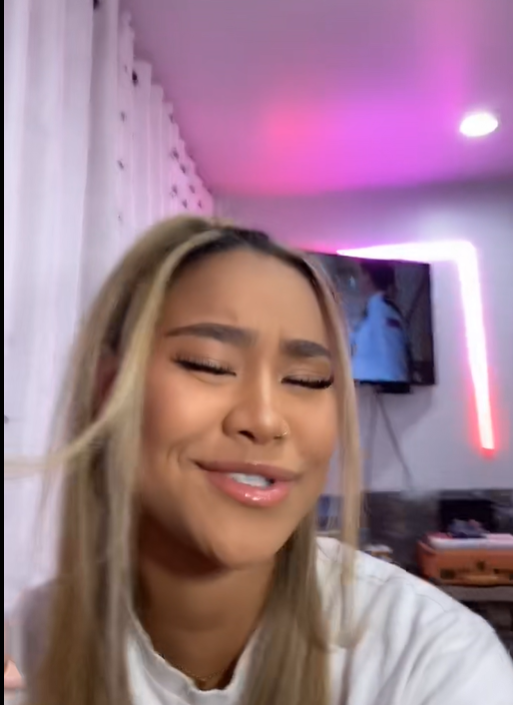 Brianna McKnight smiling with her eyes closed, from a post dated August 24, 2020. | Source: TikTok/brimcknighttt