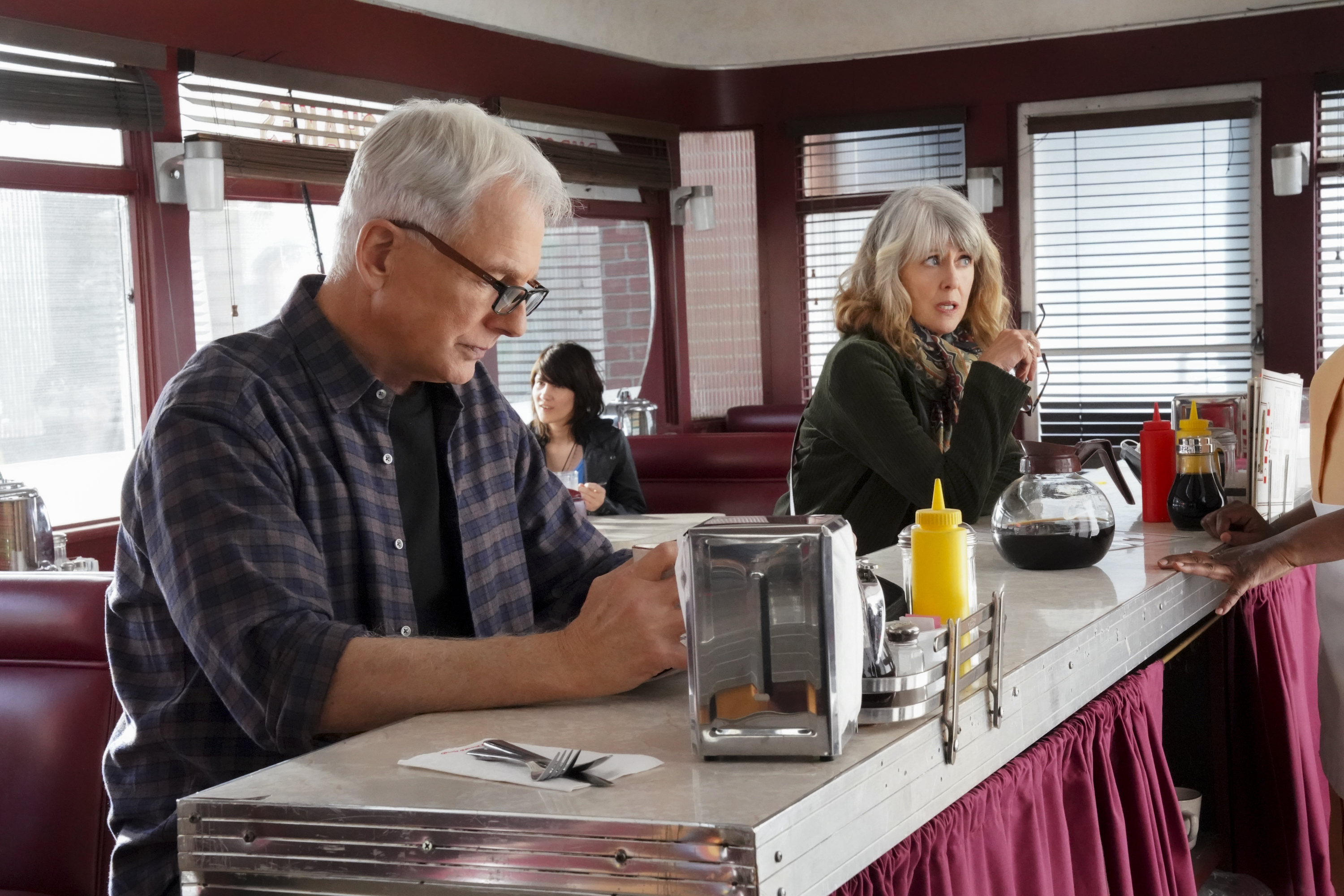 As more years passed, they both aged and their hair turned gray. At this event, Mark Harmon and Pam Dawber posed on set for the "NCIS" episode "Gut Punch" in Los Angeles, California, circa 2021. | Source: Getty Images