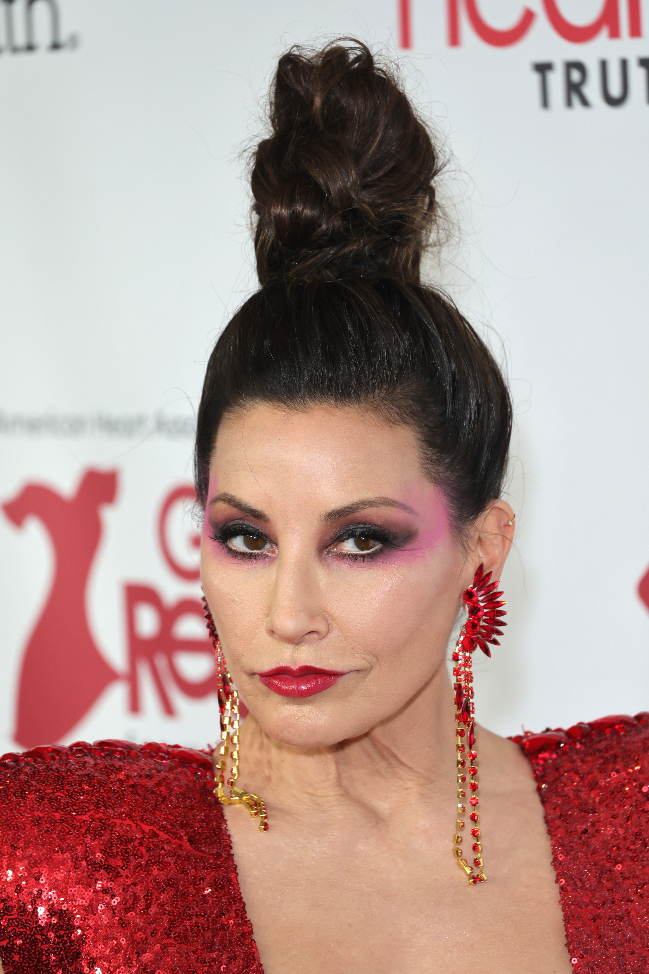 Gina Gershon at the American Heart Association's Red Dress Collection Concert on February 1, 2023, in New York | Source: Getty Images