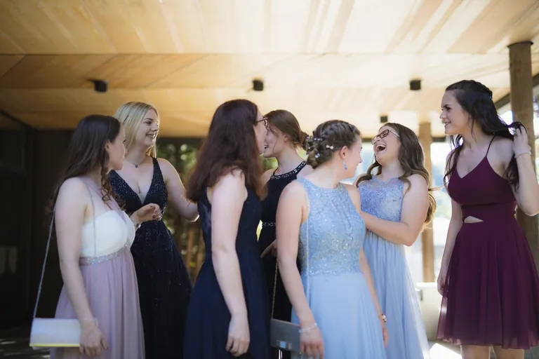 Erica was hesitant about going to prom because she knew everyone would be in designer dresses | Photo: Unsplash
