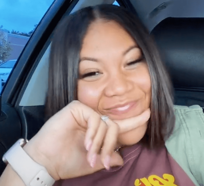 Woman appears to be chuffed with herself as she confesses to taking her boyfriend's rent money while she is the owner of the building and he is unaware | Photo: TikTok/jaynedoee0