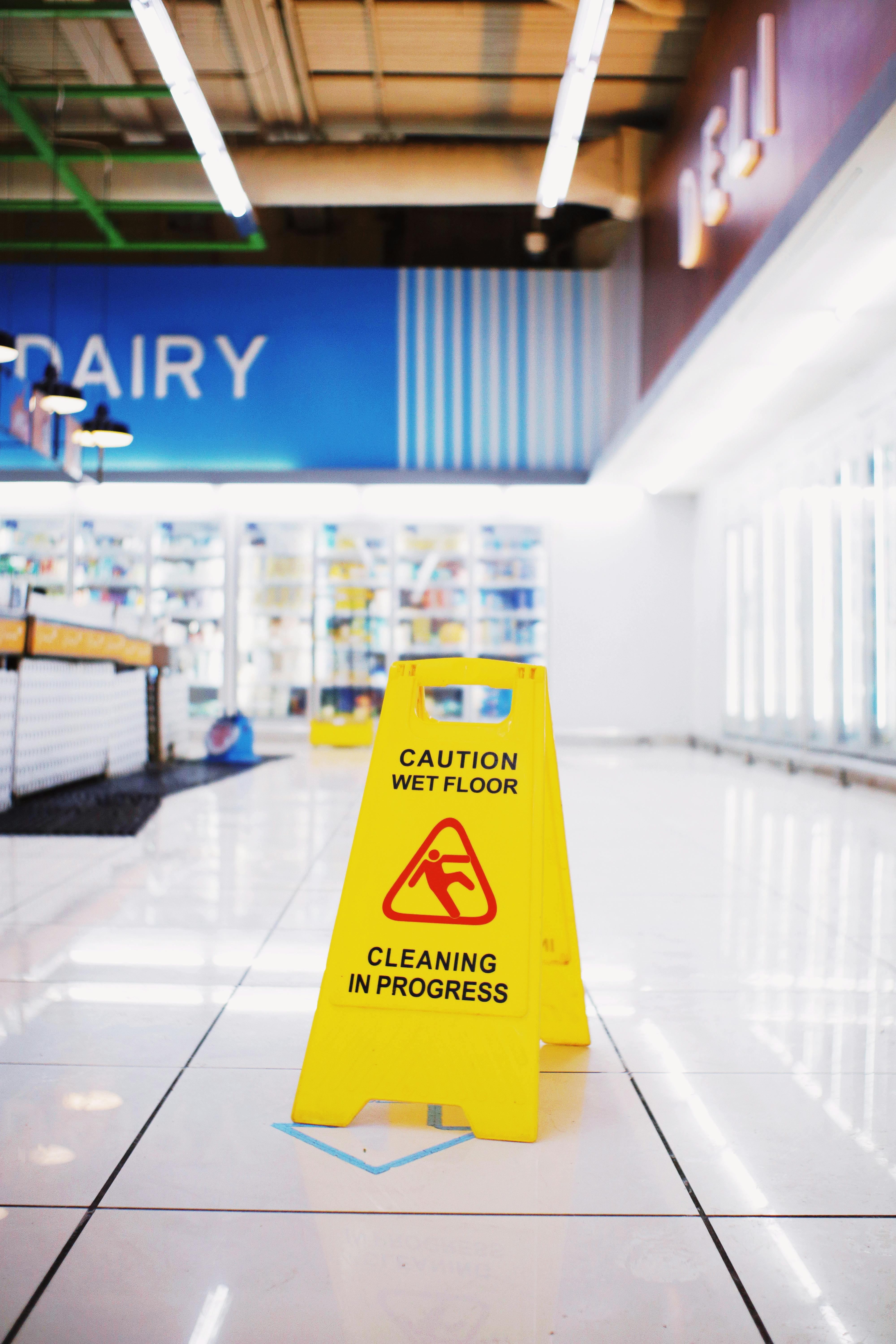 "Caution wet floor" sign in a grocery store | Source: Pexels