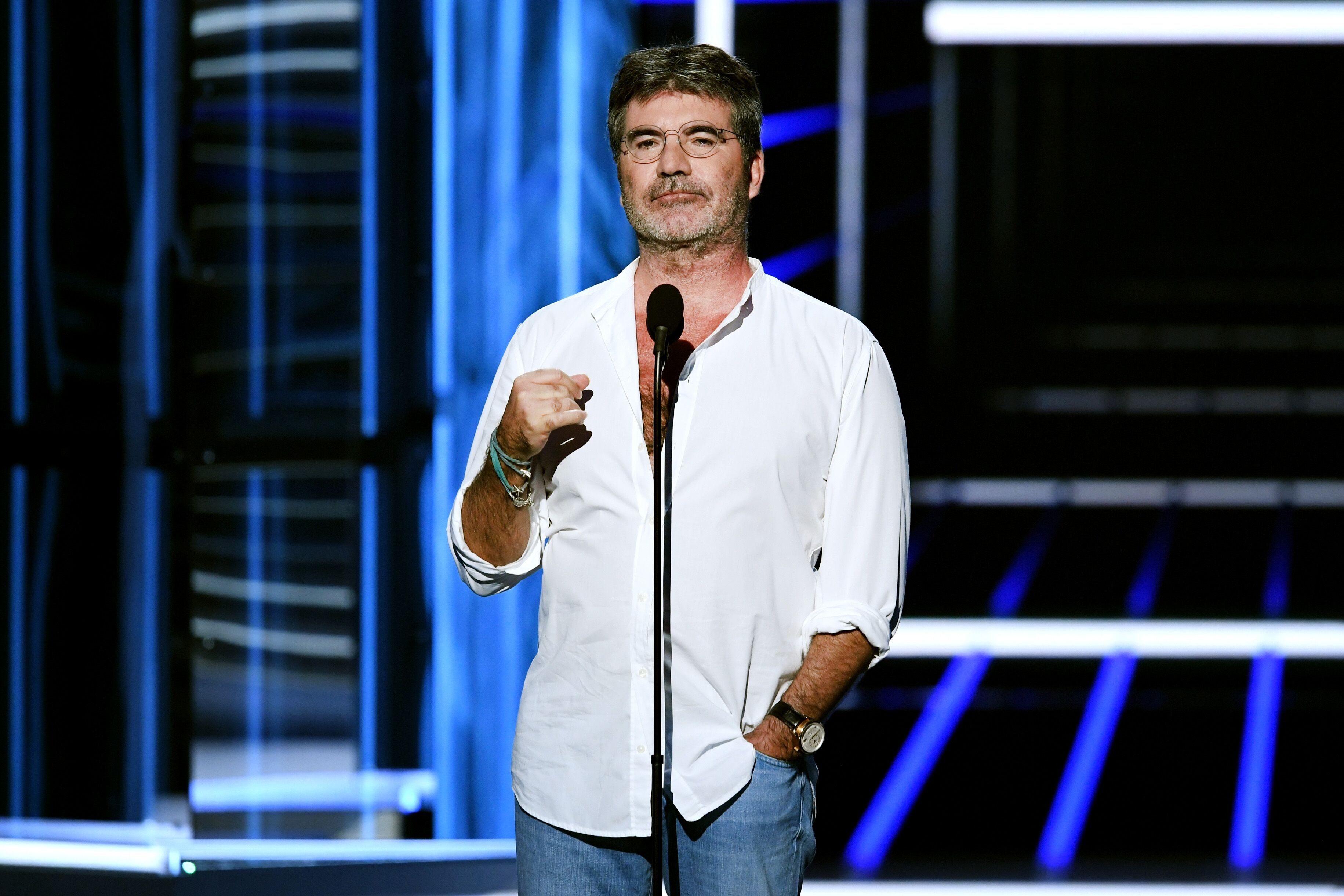 Simon Cowell speaking before an audience. | Source: Getty Images