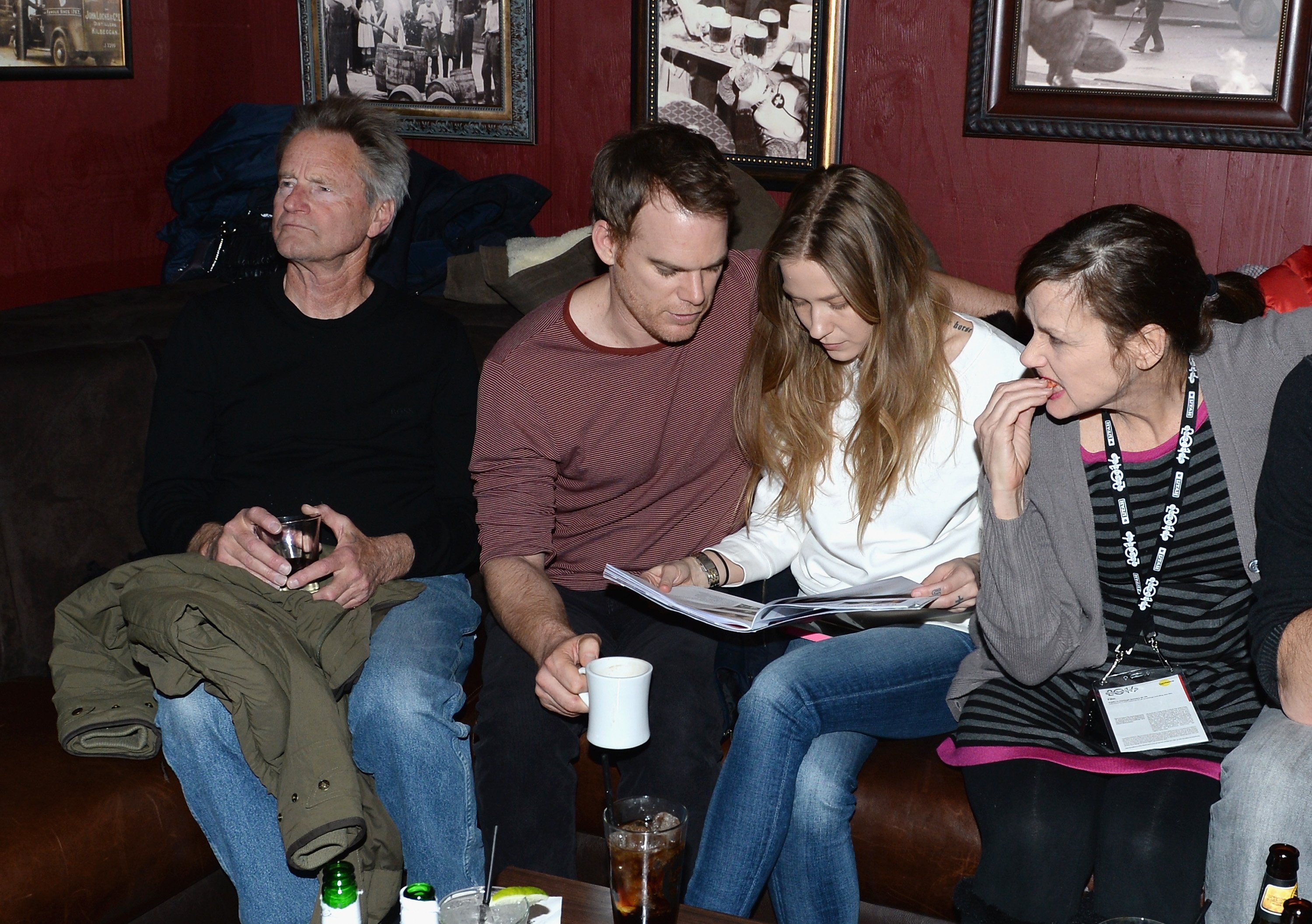 Michael C. Hall and Morgan McGregor (center) are photographed at the Brownie Brittle and Prefunc NFL playoff party at Rock & Reilly's on January 19, 2014 in Park City | Source: Getty Images