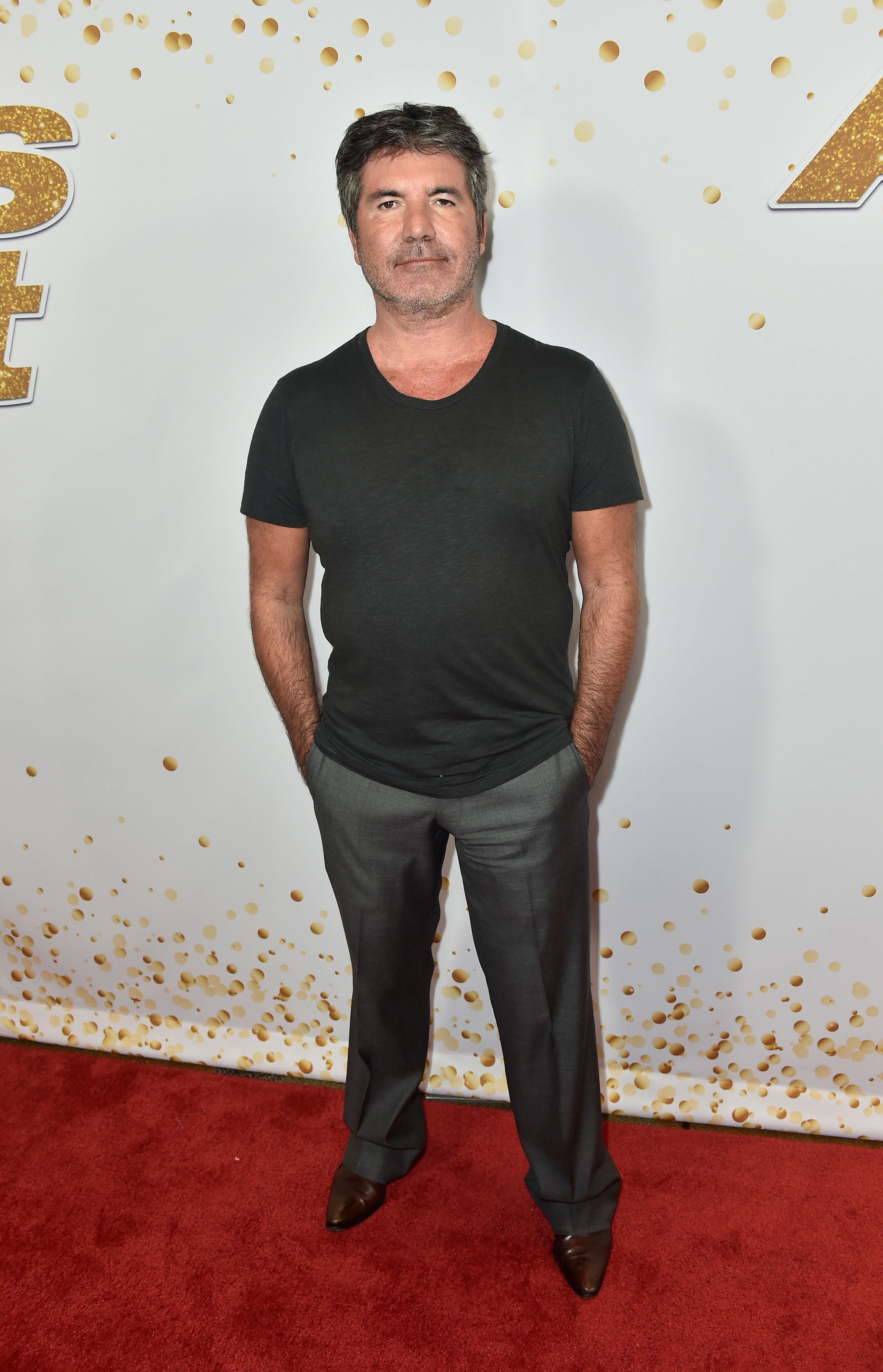 Simon Cowell attends "America's Got Talent" Season 13 Live Show Red Carpet | Getty Image / Global Images Ukraine