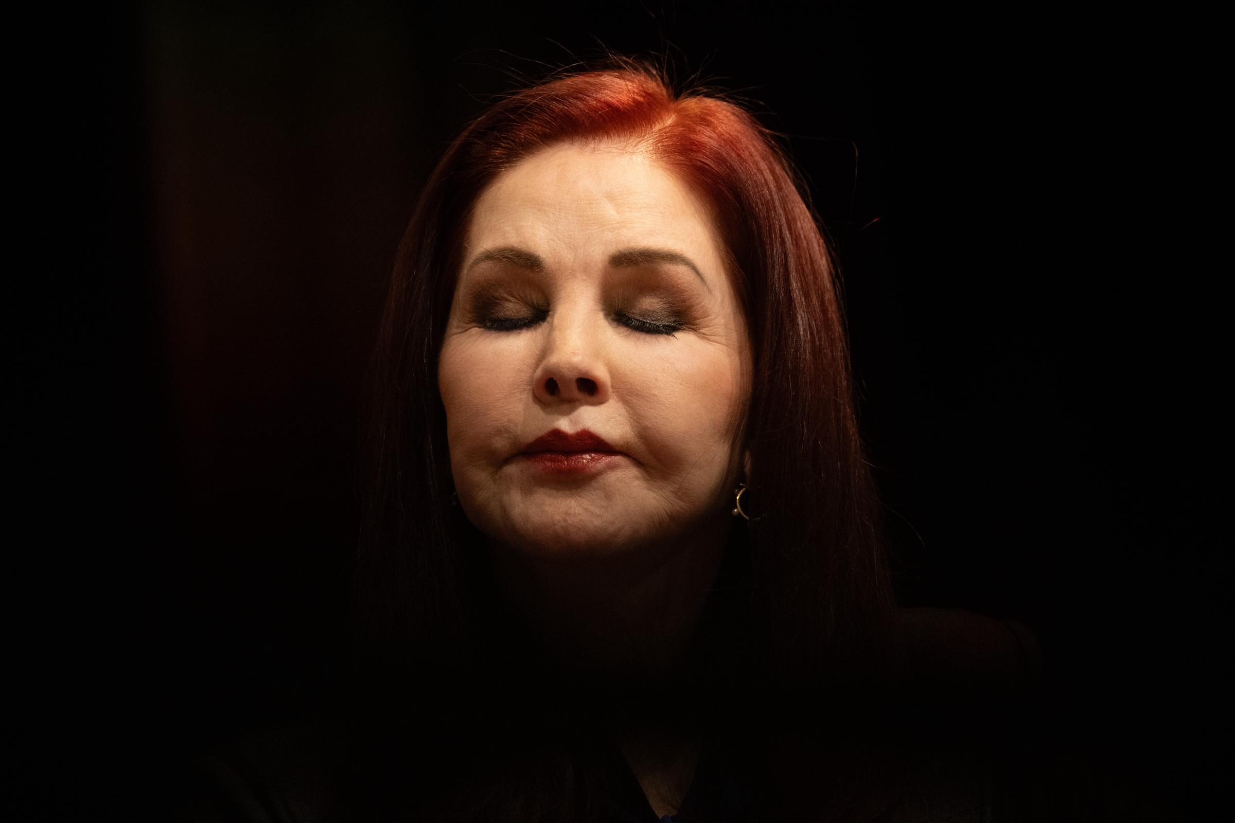 Priscilla Presley follows a journalist's question at a press conference with her eyes closed in the run-up to her talk show, on March 20, 2025 | Source: Getty Images