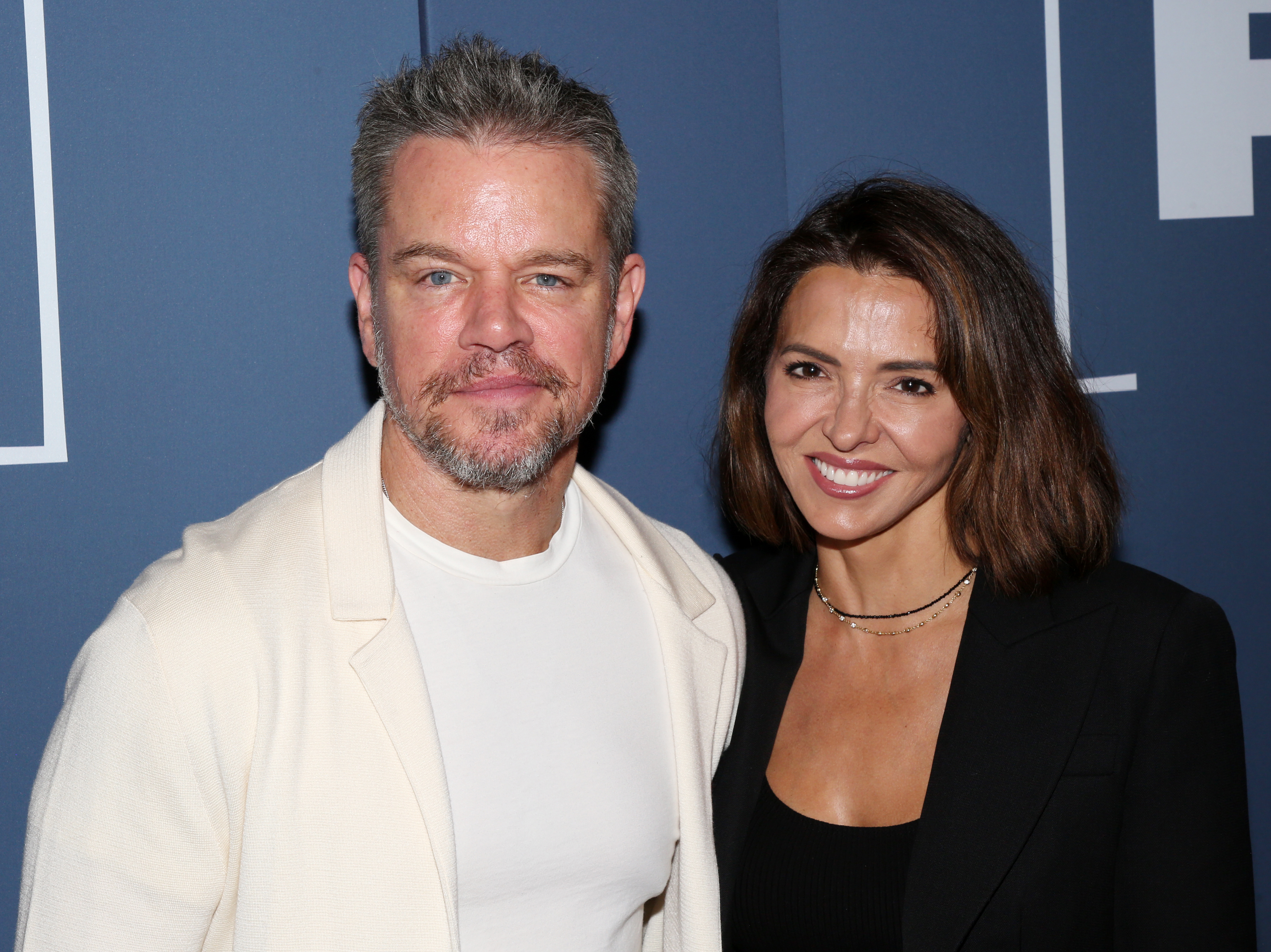 Matt Damon and wife Luciana Damon smile for photographers during the opening night of the revival of the Pulitzer Prize Winning play of 2000 at The Booth Theatre. | Source: Getty Images