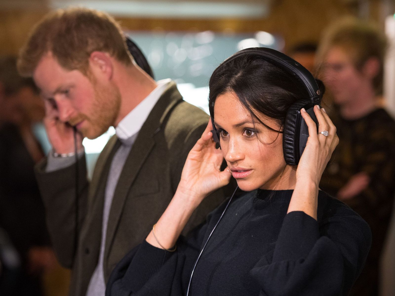 Prince Harry and Meghan Markle listen to a broadcast at Reprezent 107.3FM in Pop Brixton on January 9, 2018, in London, England | Photo: Dominic Lipinski - WPA Pool/Getty Images