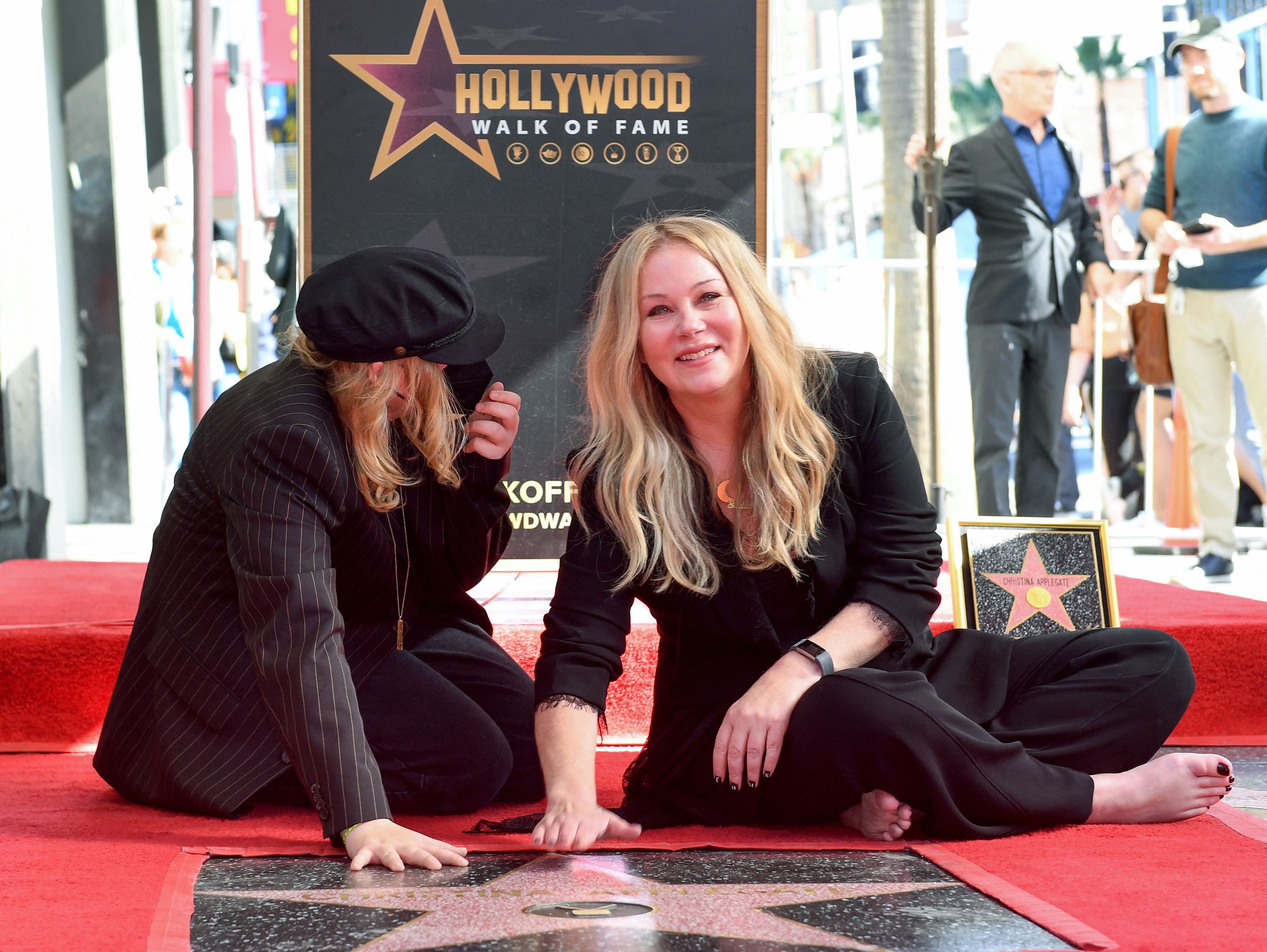 Christina Applegate and Sadie LeNoble pose for photos with Applegate's newly unveiled Hollywood Walk of Fame star, on November 14, 2022 | Source: Getty Images