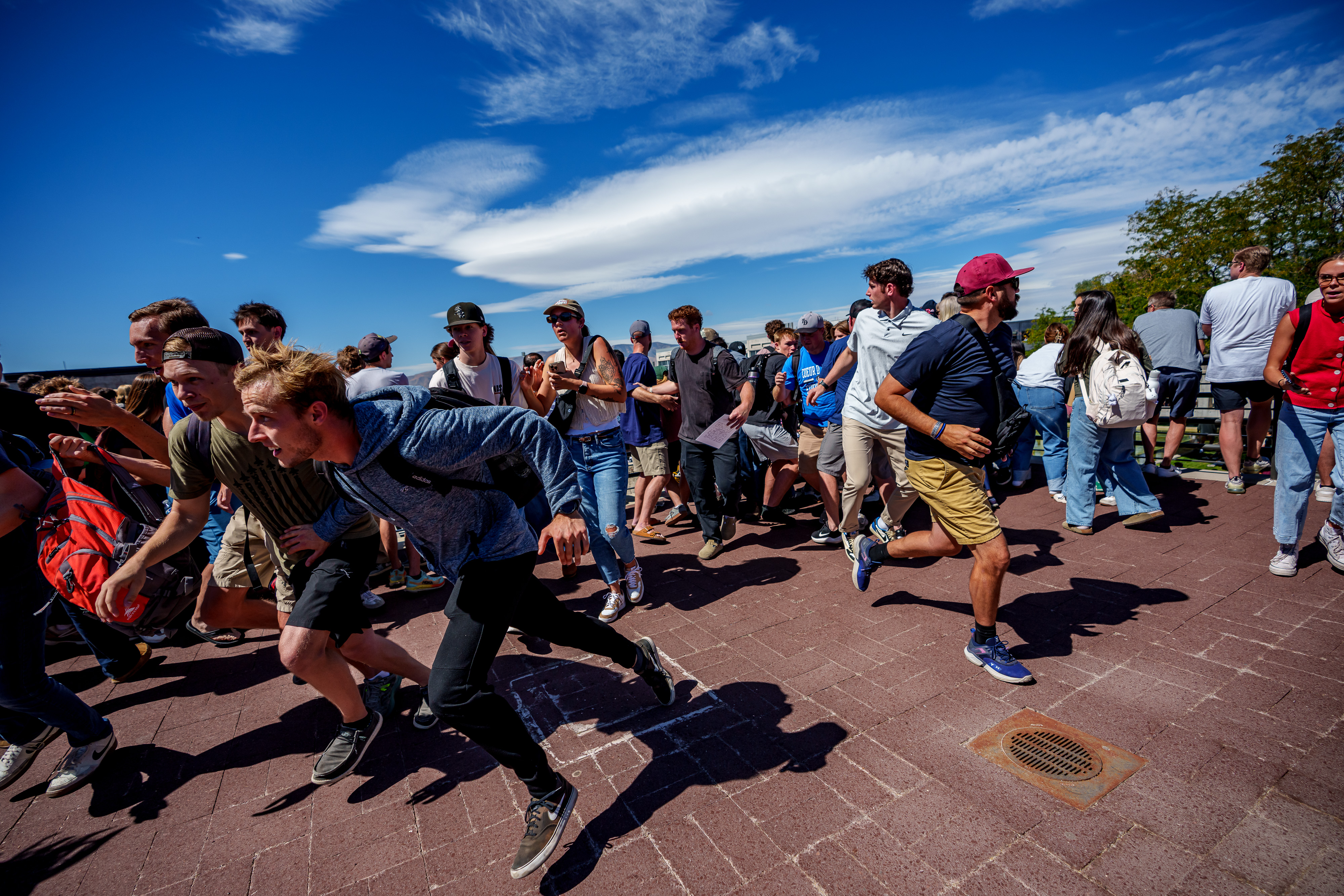 People run after shots were fired during an appearance by Charlie Kirk at Utah Valley University on September 10, 2025 in Orem | Source: Getty Images