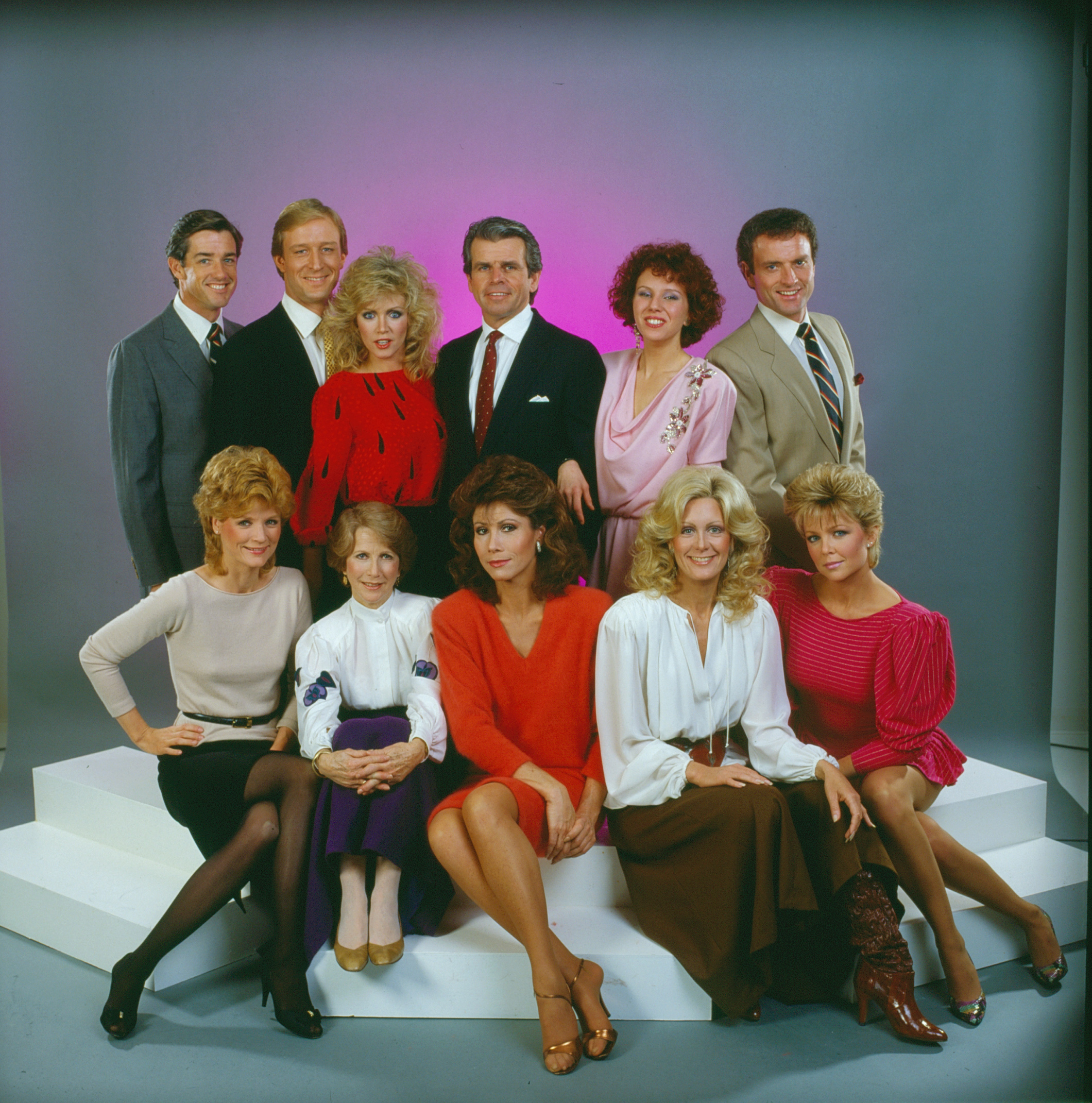 Back row from left, Douglas Sheehan, Ted Shackleford, Donna Mills, William Devane, Claudia Lonow, and Kevin Dobson: Front row from left, Constance McCashin, Julie Harris, Michele Lee, Joan Van Ark, and Lisa Hartman. The "Knots Landing cast" in 1984. | Source: Getty Images