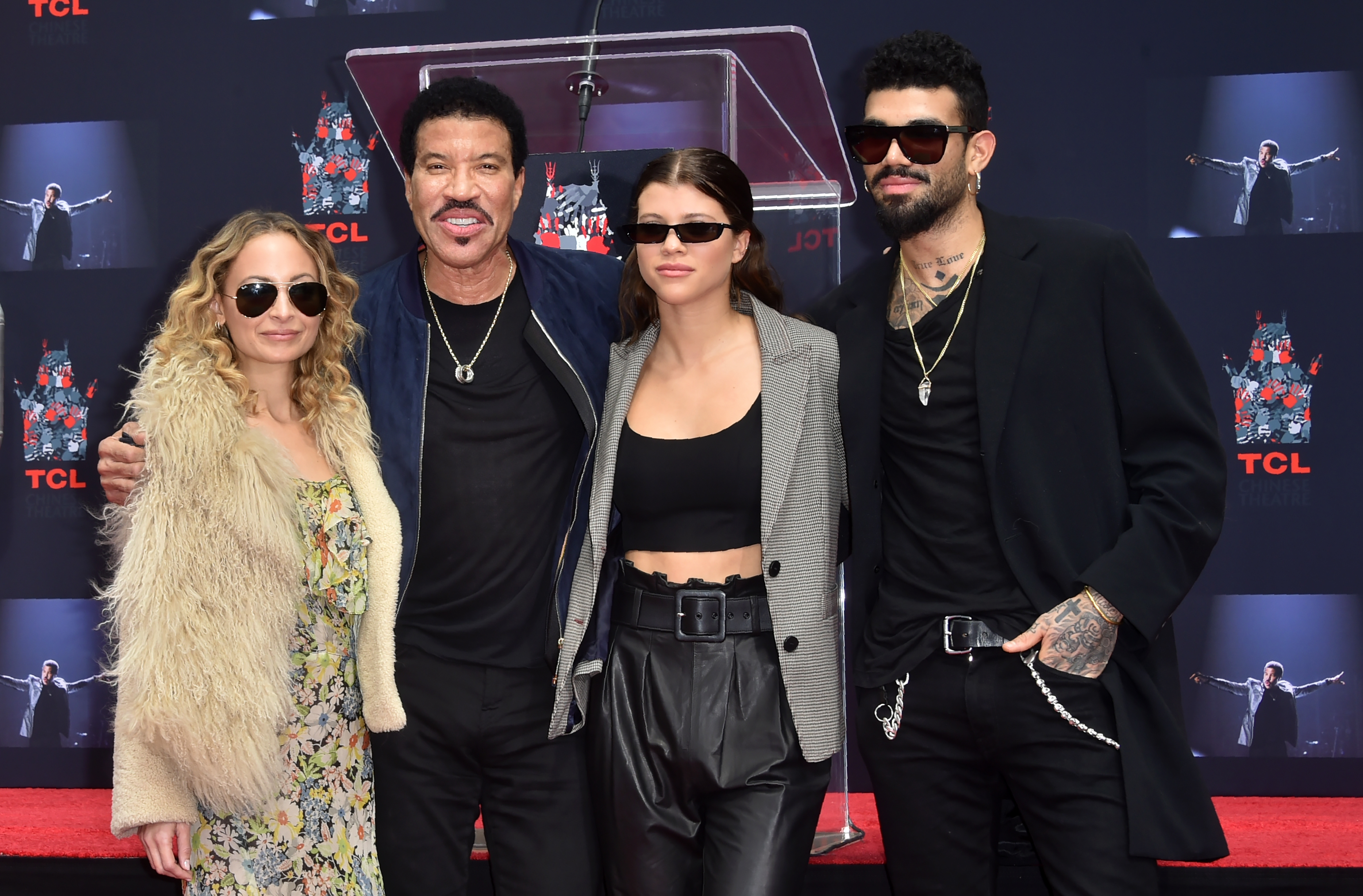 Nicole Richie, Lionel Richie, Sofia Richie and Miles Richie pose at his Hand and Footprints ceremony at the TCL Theater on March 7,2018 in Hollywood, California. | Source: Getty Images
