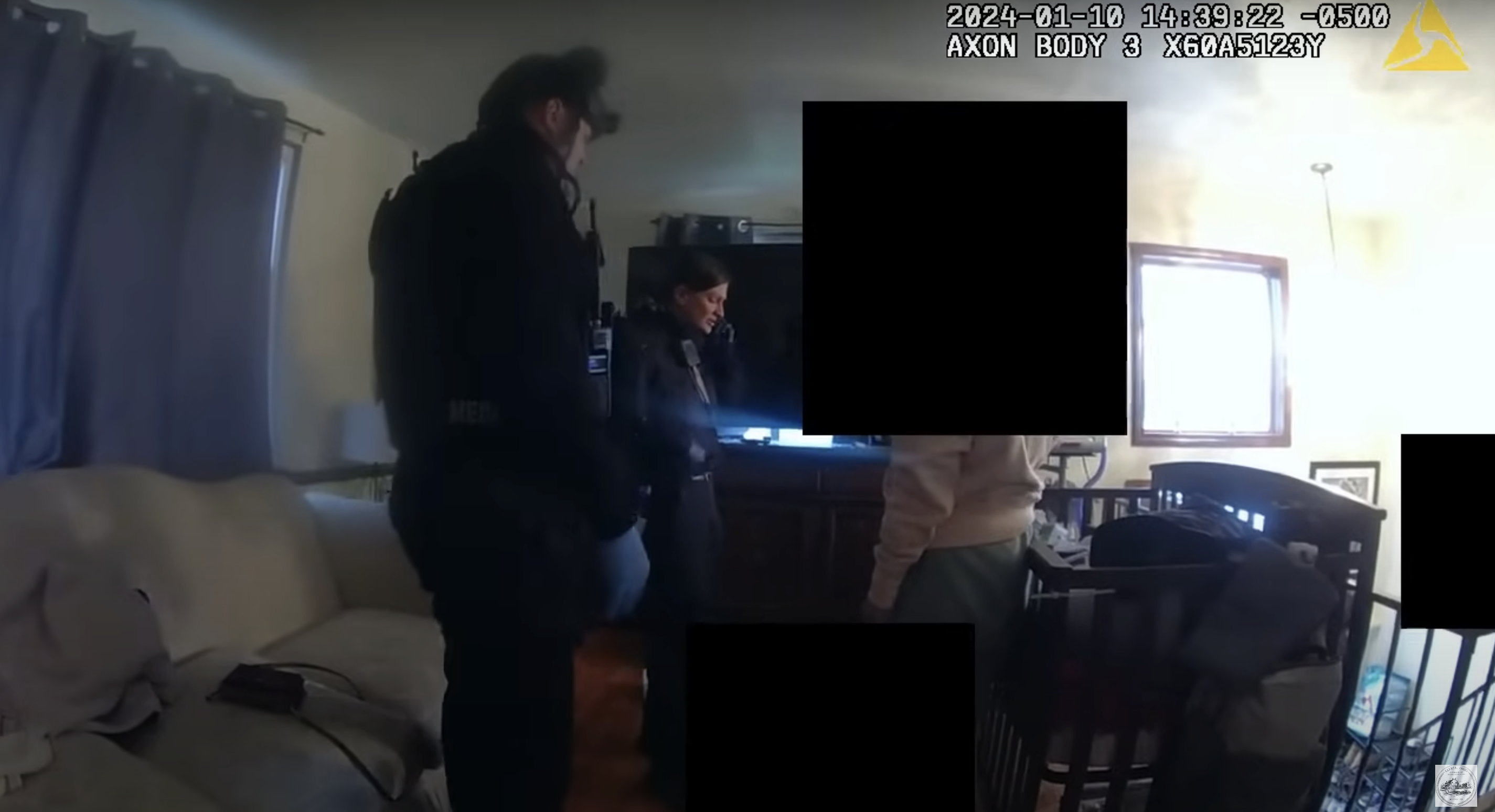 Police officers standing near Waylon's crib, as seen in a video dated January 17, 2024 | Source: youtube.com/CityofElyriaChannel